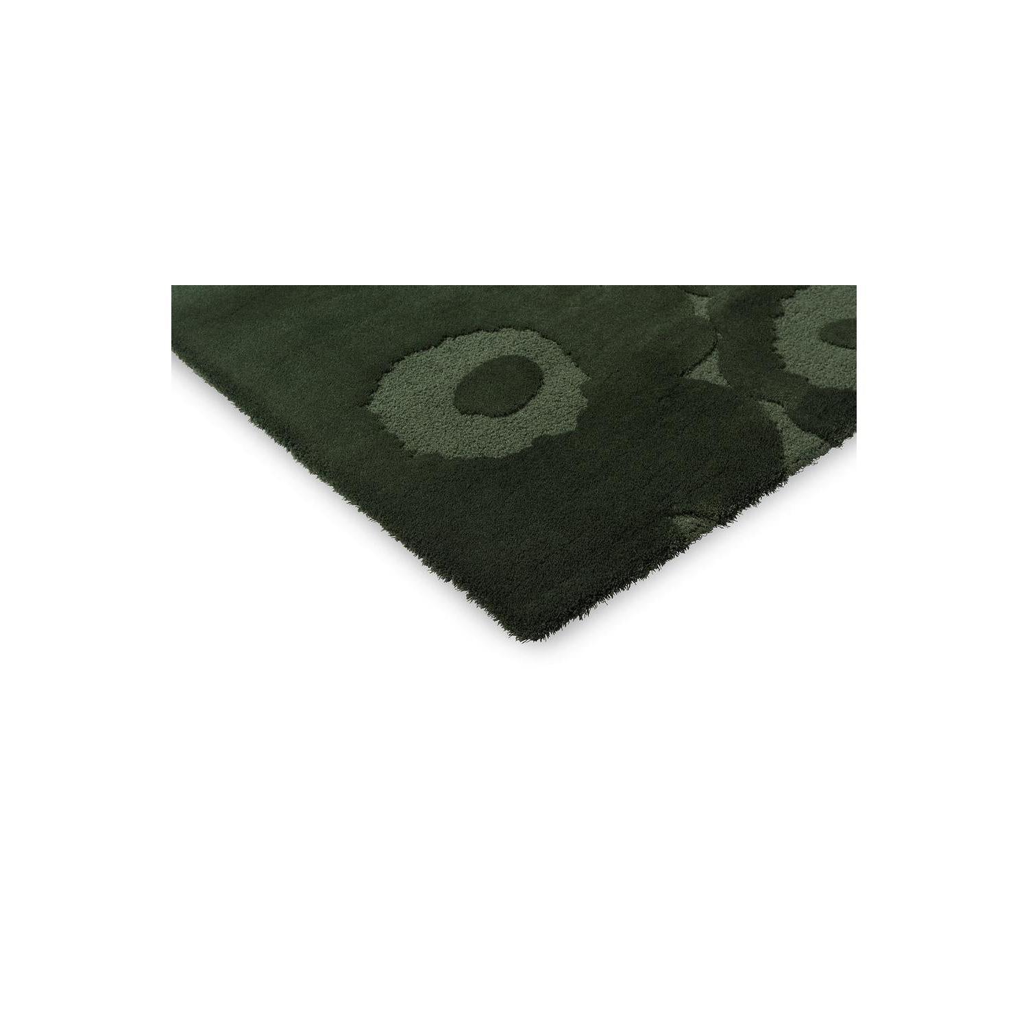 Marimekko Unikko Dark Green Rug featuring bold poppy pattern in dark forest green, olive and moss on deep green background, machine-woven wool