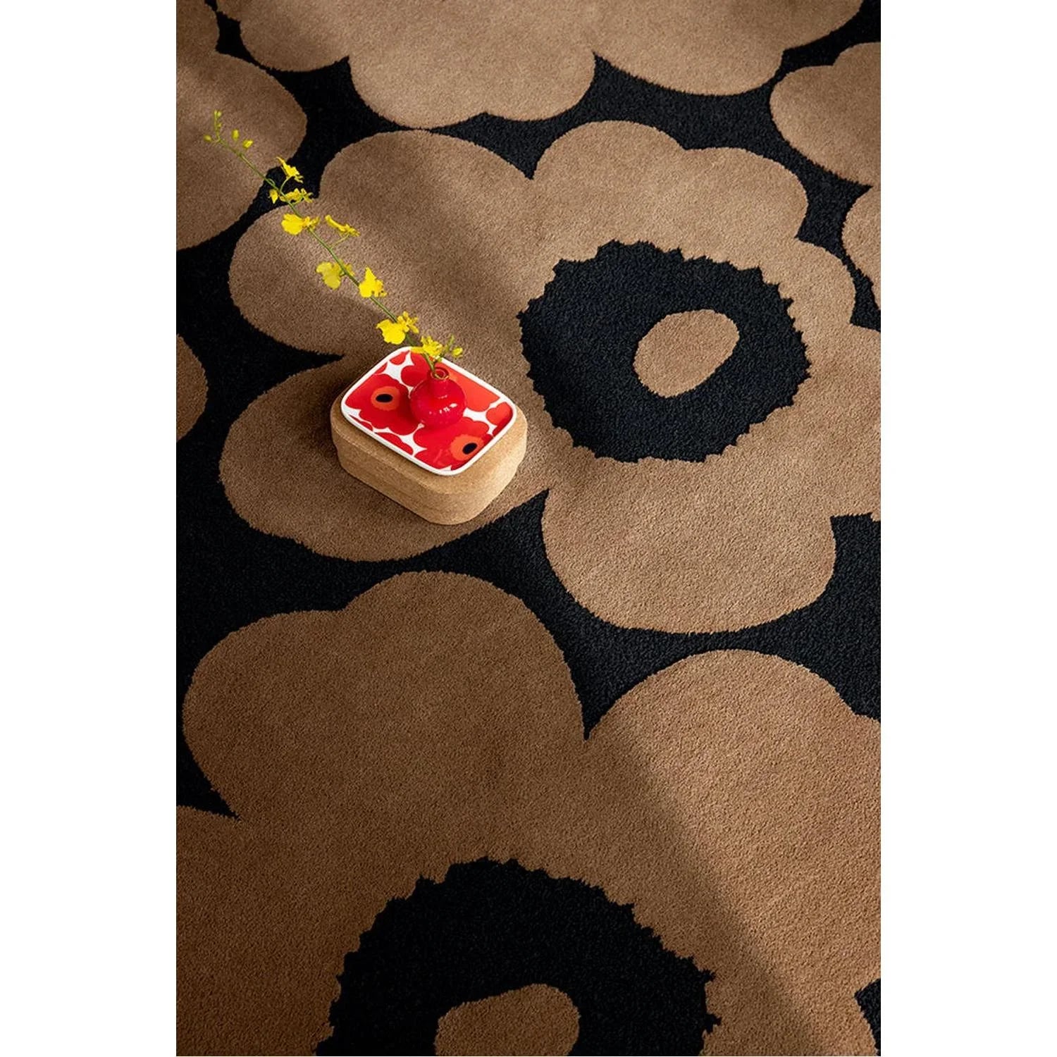 Marimekko Unikko Beige Rug featuring bold floral pattern in taupe brown and black on beige background, hand-tufted wool