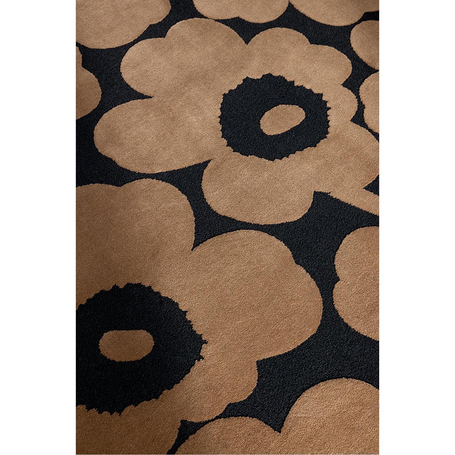 Marimekko Unikko Beige Rug featuring bold beige floral pattern on black background, machine-made wool
