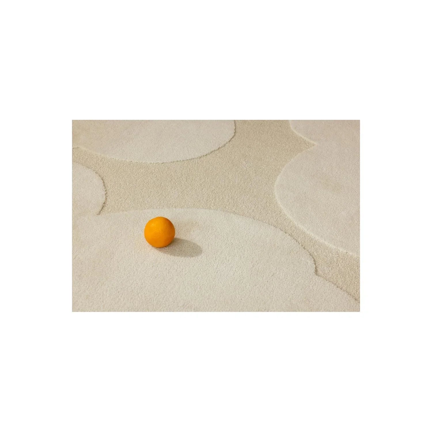 Marimekko Iso Unikko Natural White rug featuring abstract circular pattern in cream, beige and taupe on natural ivory, hand-tufted wool