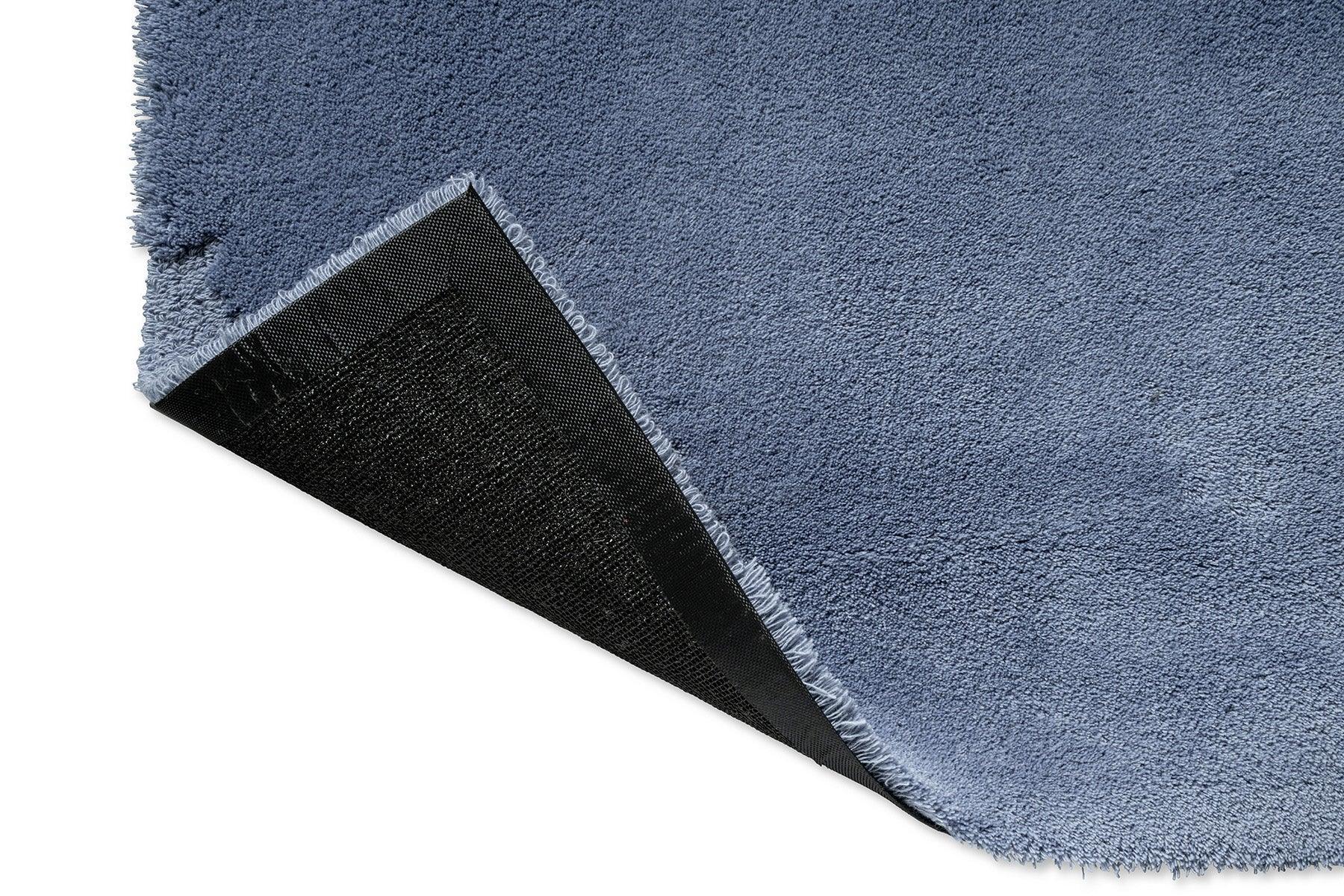 Marimekko Iso Unikko Dusty Blue Rug featuring textured pile in dusty blue, ice blue and light blue on white, tufted wool