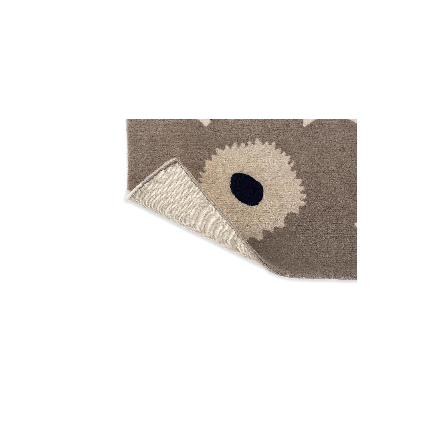 Marimekko Unikko Greige rug by Brink & Campman featuring bold floral pattern in beige, cream and navy on greige background