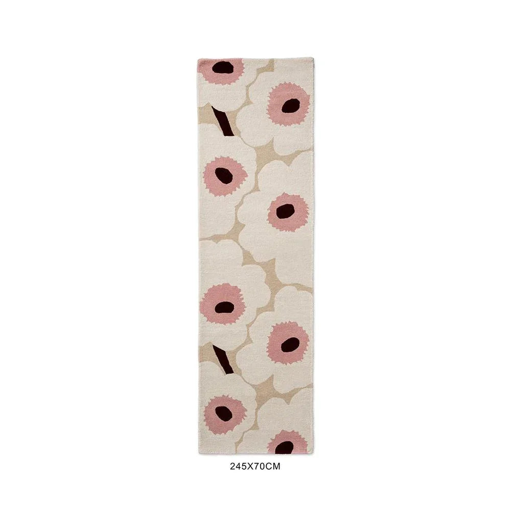 Marimekko Unikko rug featuring bold floral poppy pattern in pink, beige and burgundy on cream background, hand-tufted wool