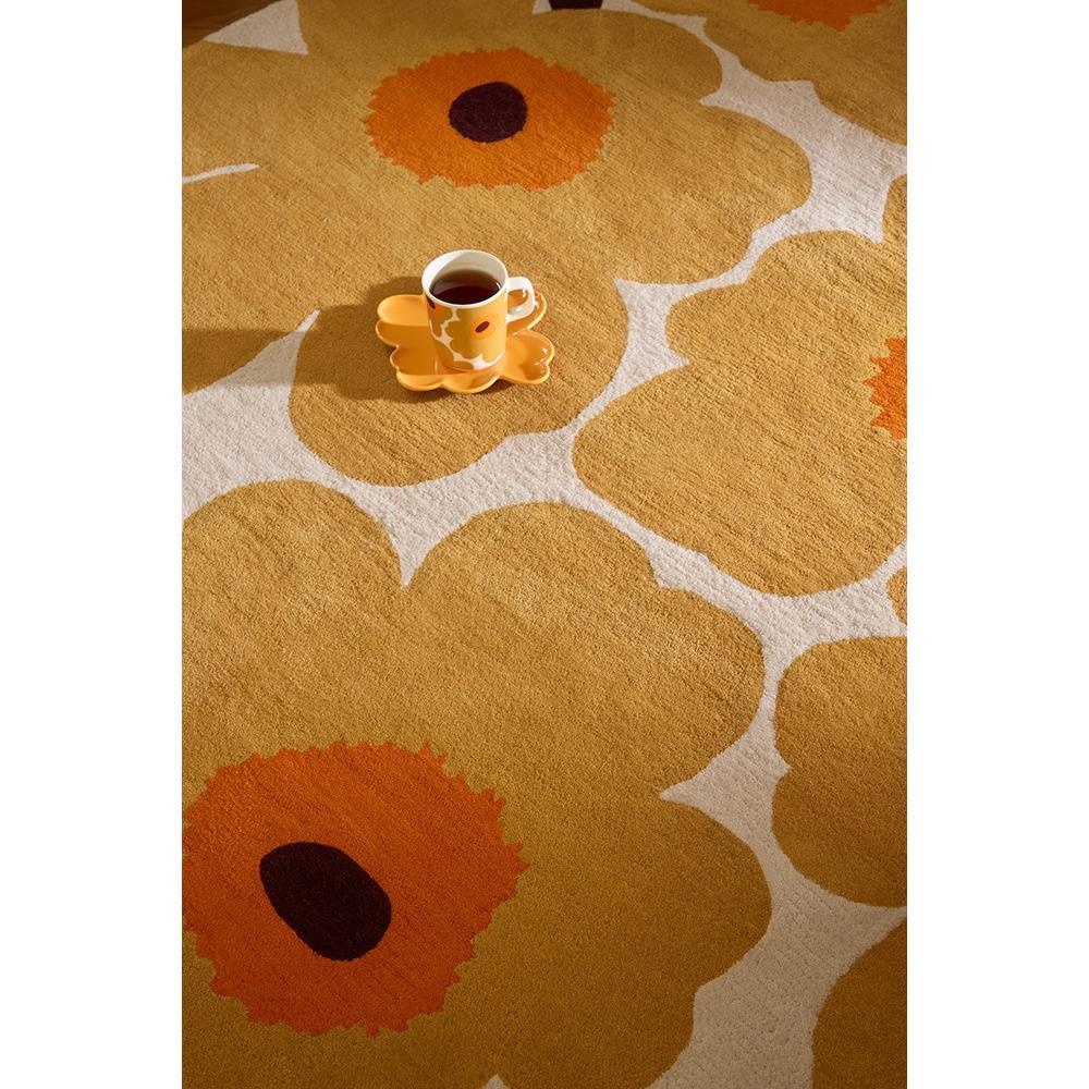 Marimekko Unikko Honey 132406 Rug featuring floral pattern in mustard, orange, brown on cream background, tufted wool