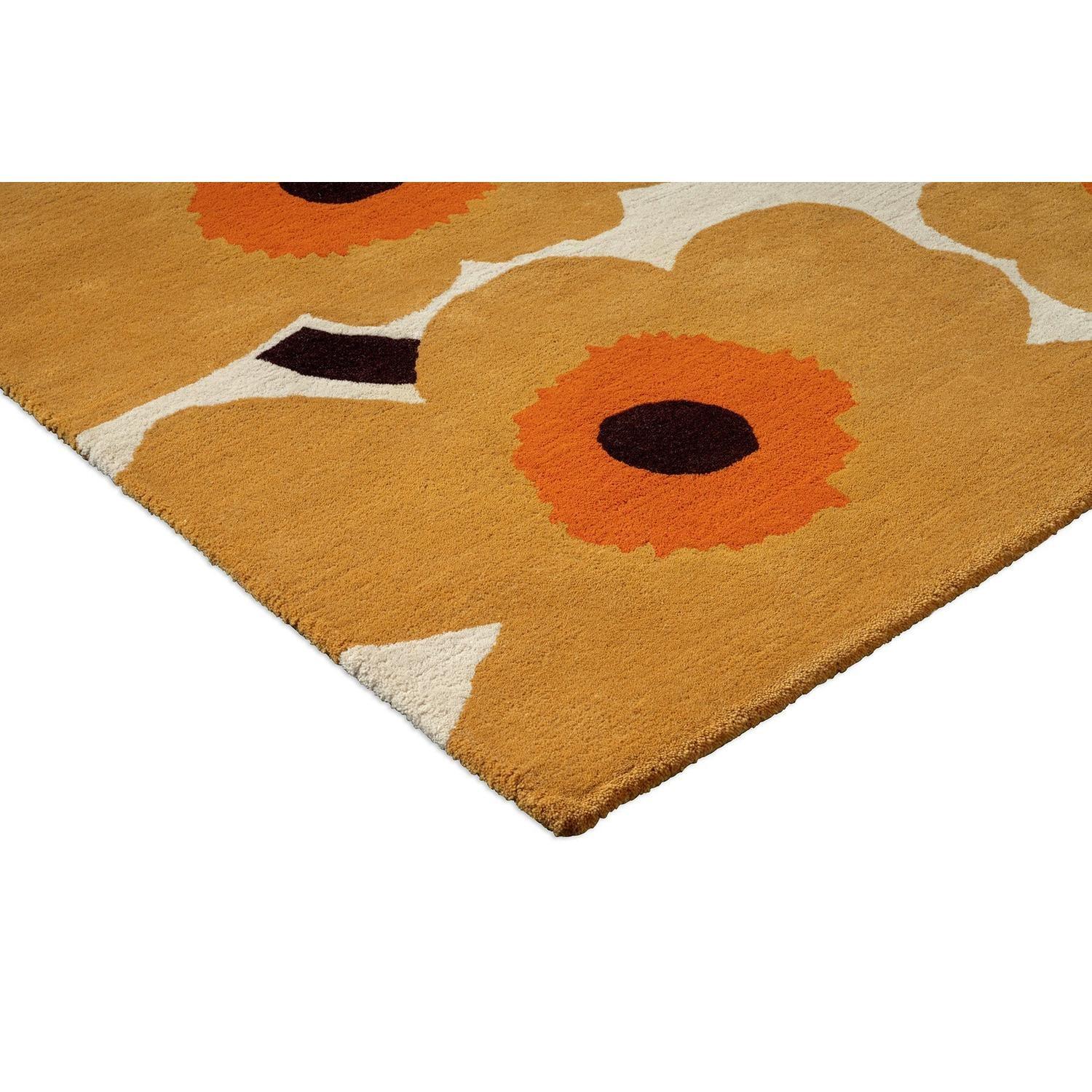 Marimekko Unikko Honey rug featuring floral poppy in honey, burnt orange, black and ivory on ochre backdrop tufted wool