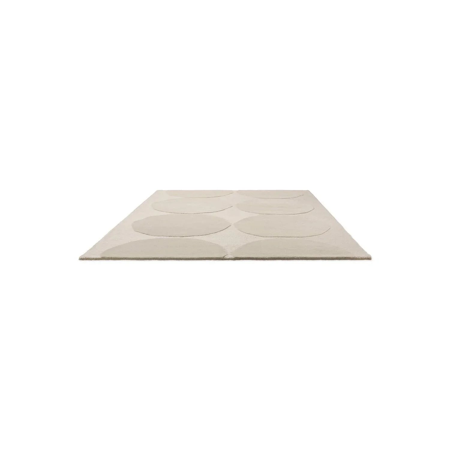 Marimekko Isot Kivet Natural White rug featuring circular pebble pattern in cream and beige on ivory background, hand-tufted wool