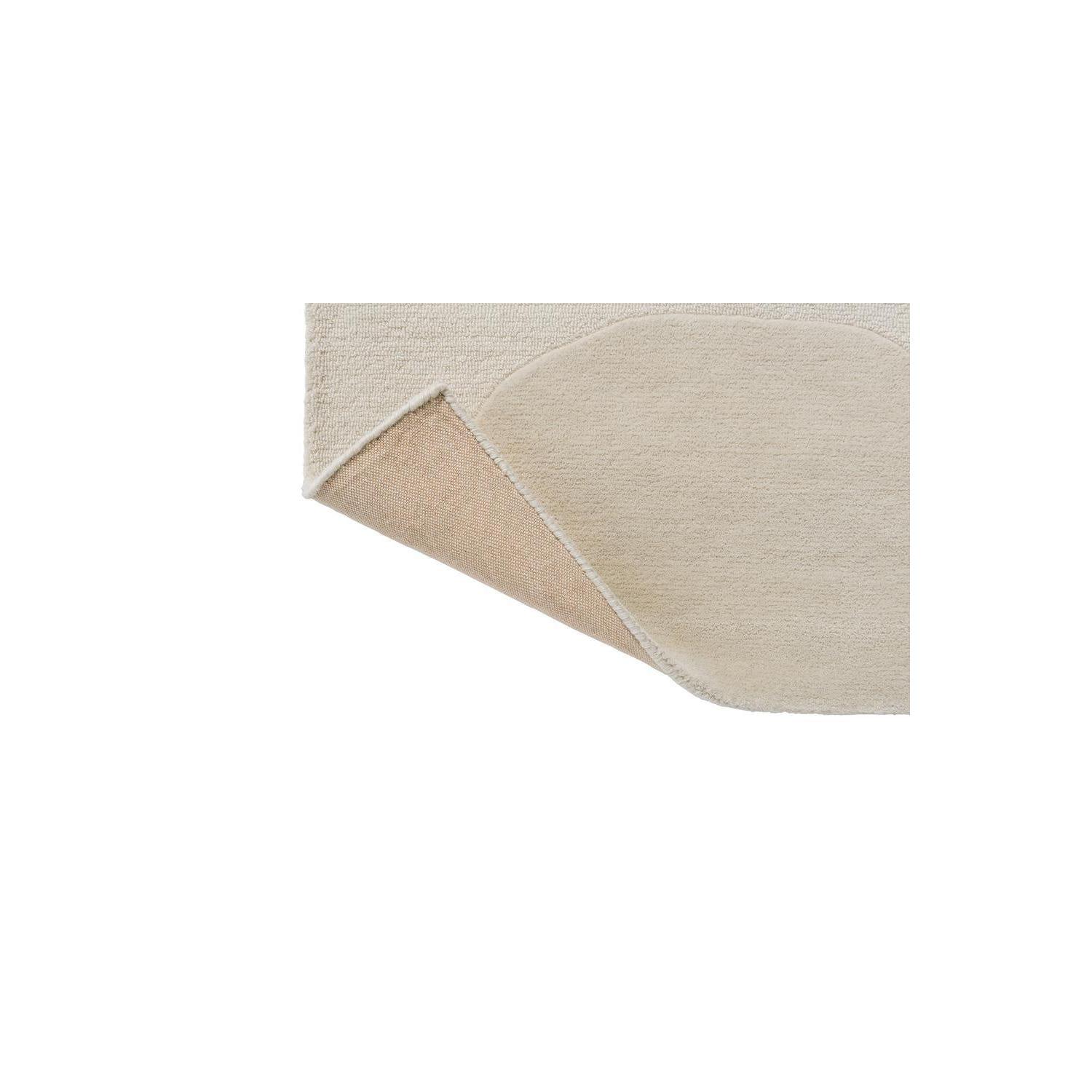 Marimekko Isot Kivet Natural White rug featuring circular stone motif in cream and beige on ivory background, hand-tufted wool