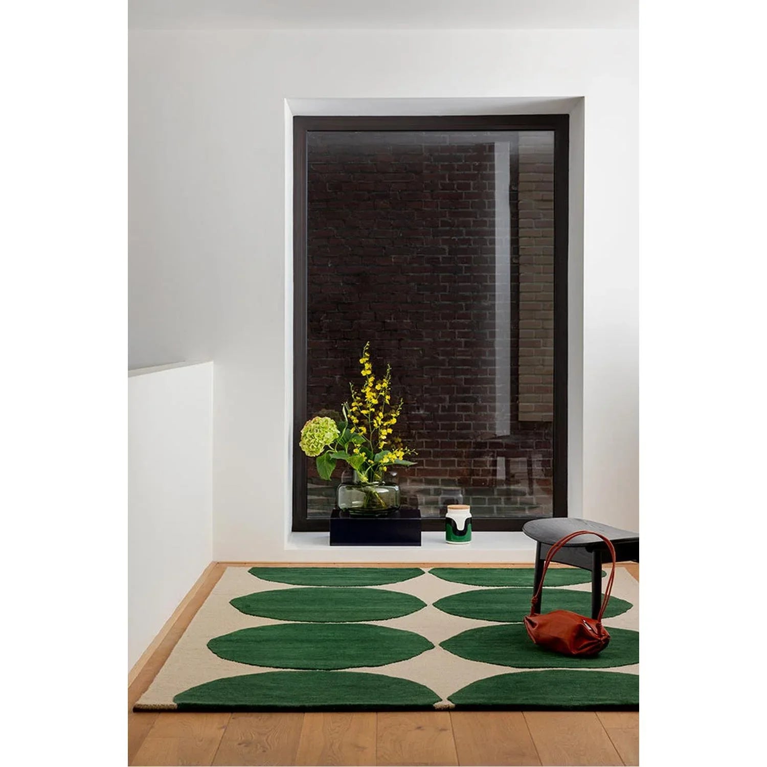 Marimekko Isot Kivet Green Designer Rug featuring circular pattern in green and dark green on beige background, machine-made BRINK & CAMPMAN rug