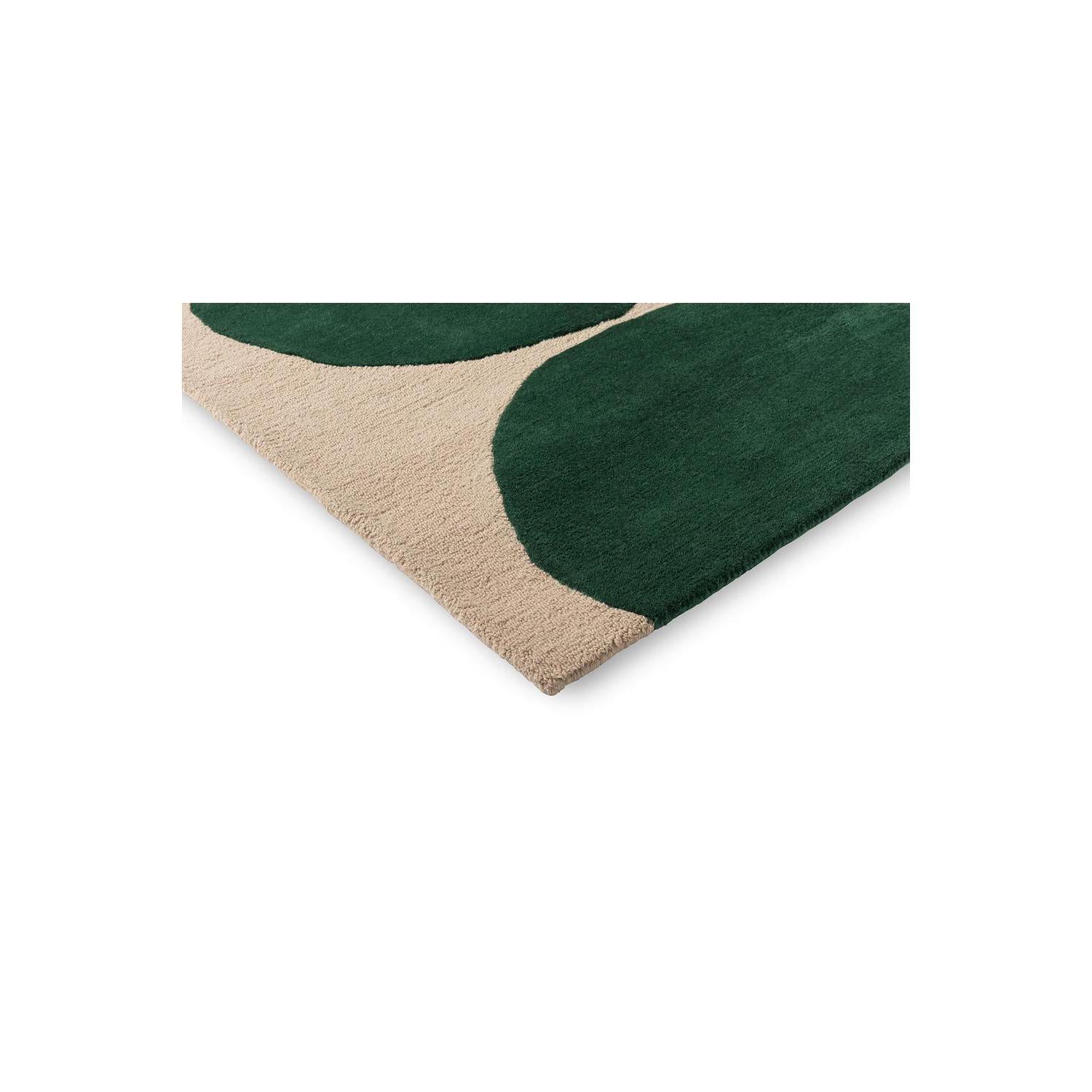Marimekko Isot Kivet Green Designer Rug featuring abstract pebble pattern in dark green and beige on cream background, hand-tufted wool