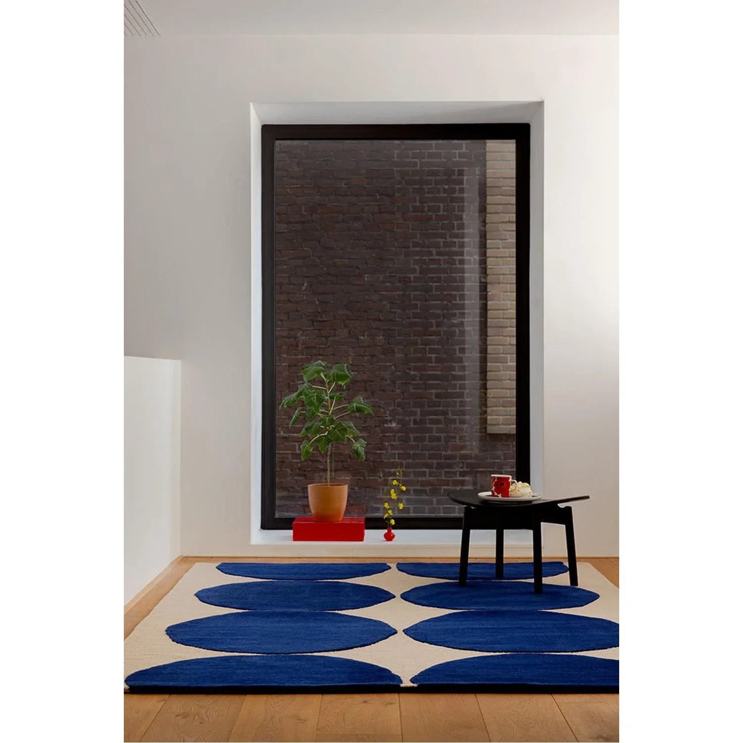 Marimekko Isot Kivet Blue Designer Rug featuring oval pattern in cobalt blue and navy on cream background, hand-tufted wool