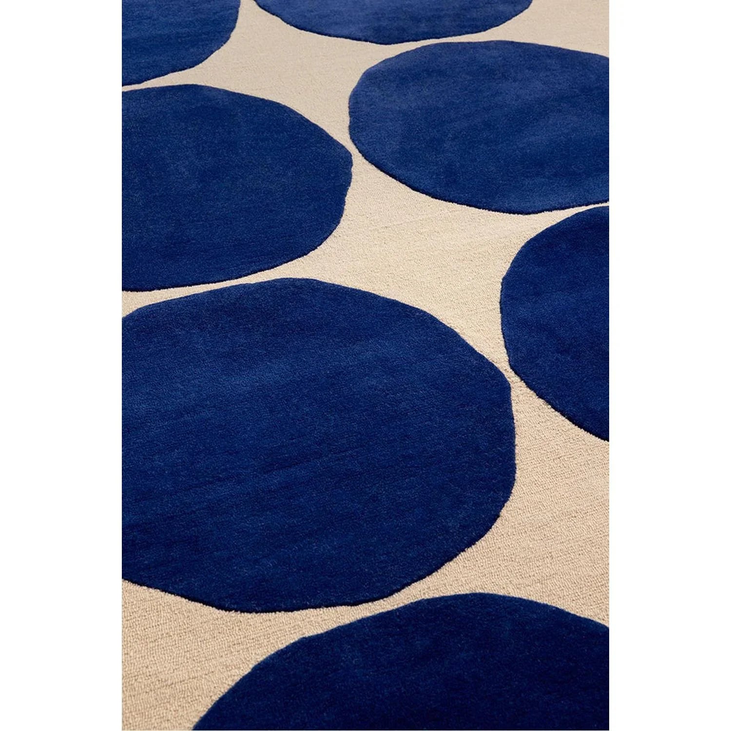 Marimekko Isot Kivet Blue Designer Rug featuring bold circles in navy blue on beige background, machine-made polypropylene