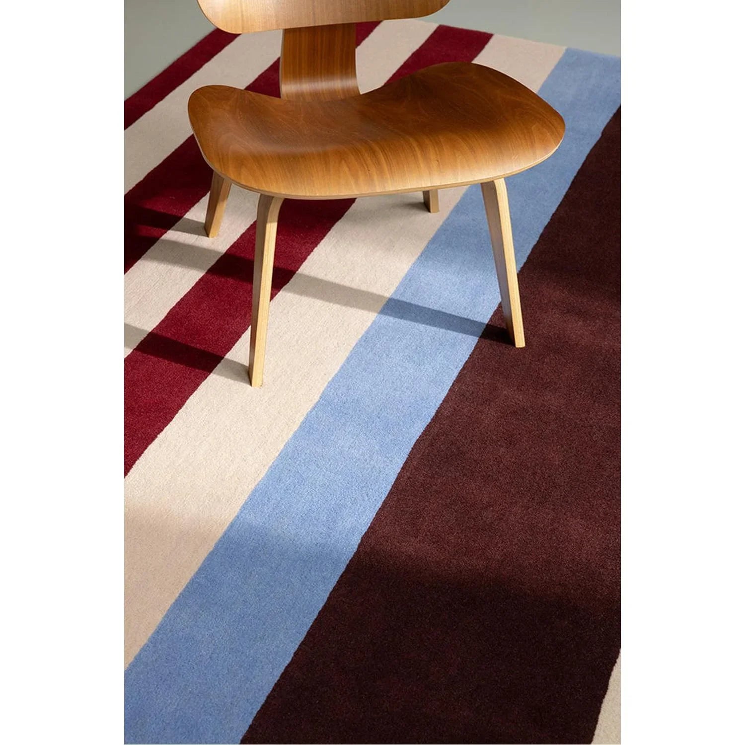 Marimekko Ralli Burnt Orange Rug featuring bold stripe pattern in burgundy, cream, light blue on cream background, hand-tufted wool