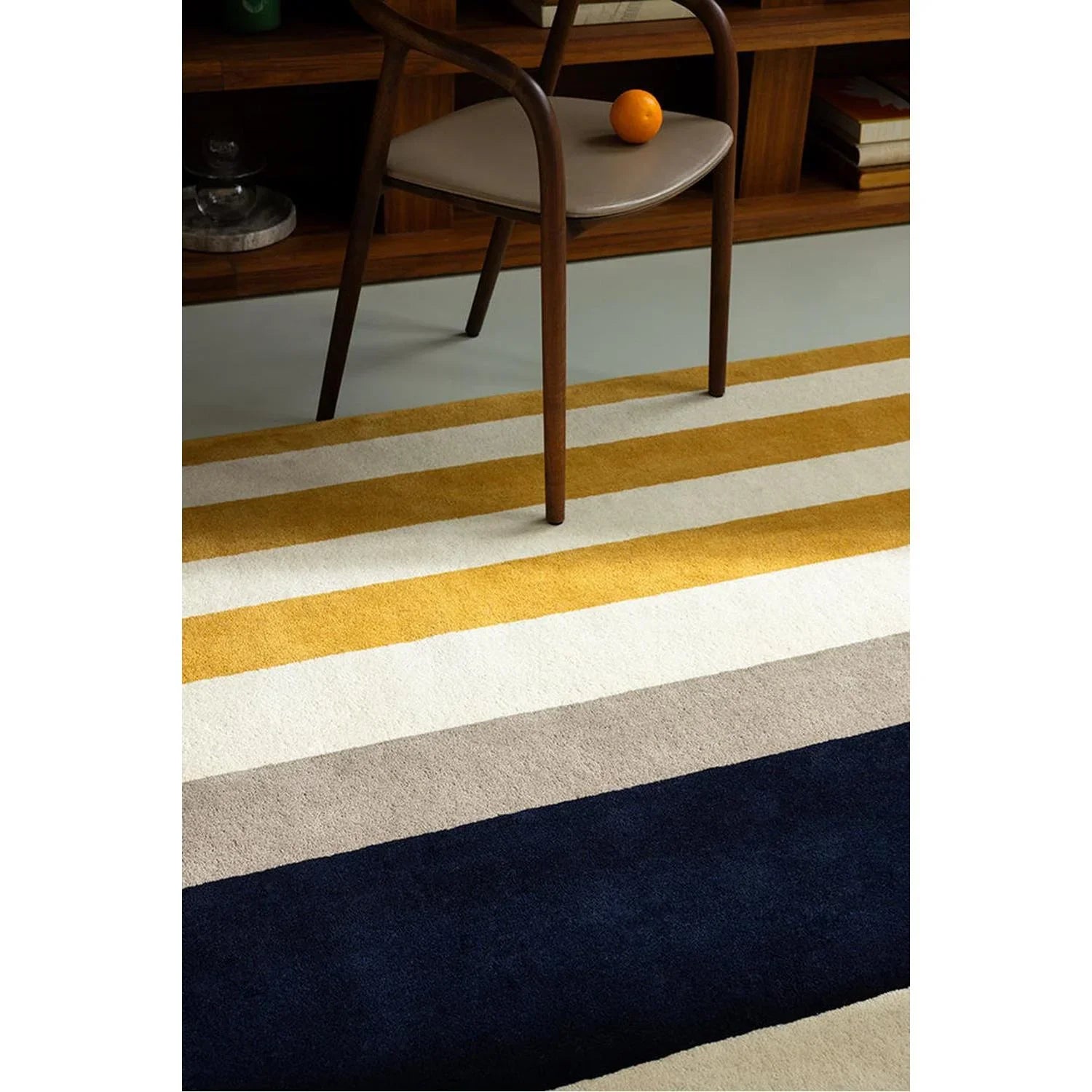 Marimekko Ralli Yellow Designer Rug featuring striped pattern in mustard yellow, ivory, beige and navy on cream background, hand-tufted wool