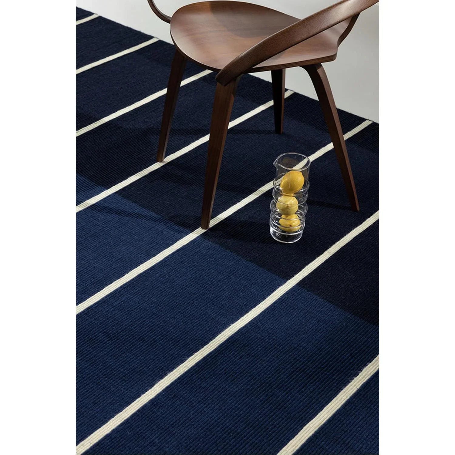 Marimekko Tiibet Deep Blue Designer Rug by Brink & Campman featuring navy blue and cream stripes on deep blue background, hand-tufted wool