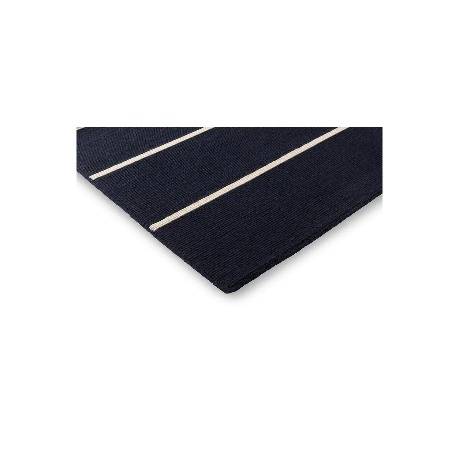 Marimekko Tiibet Deep Blue Rug featuring navy and cream stripes on deep blue background, machine-woven wool