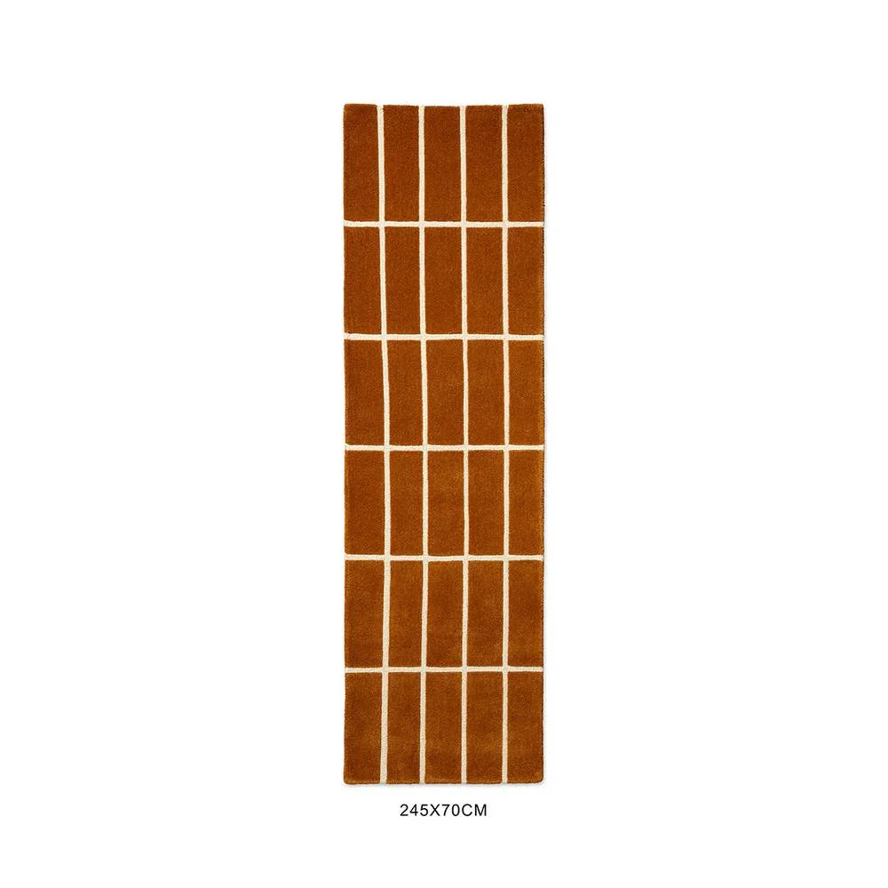 Marimekko Tiiliskivi Brown runner rug with burnt orange and ivory grid on burnt orange background machine-woven wool