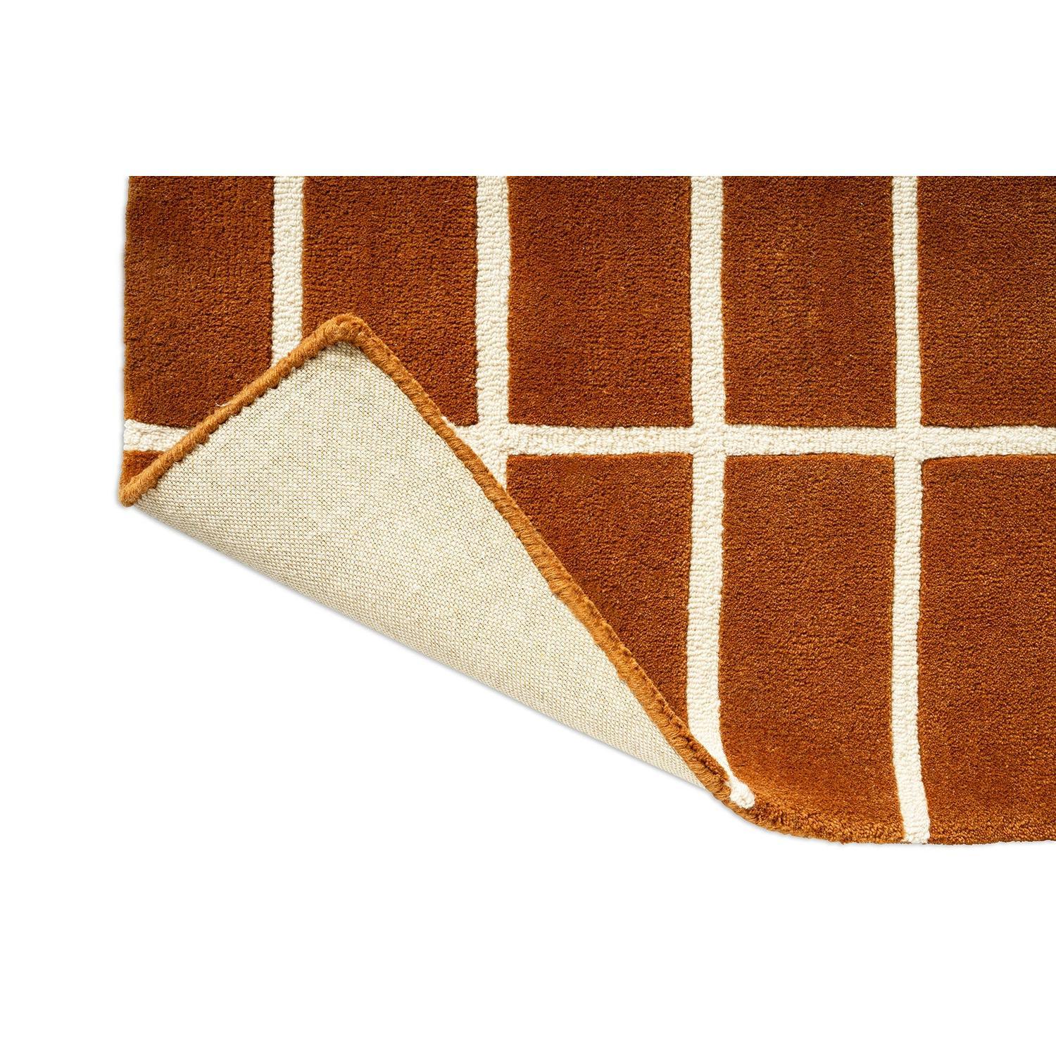 Marimekko Tiiliskivi Runner Rug featuring geometric grid in burnt brown and ivory on warm brown, machine-woven wool