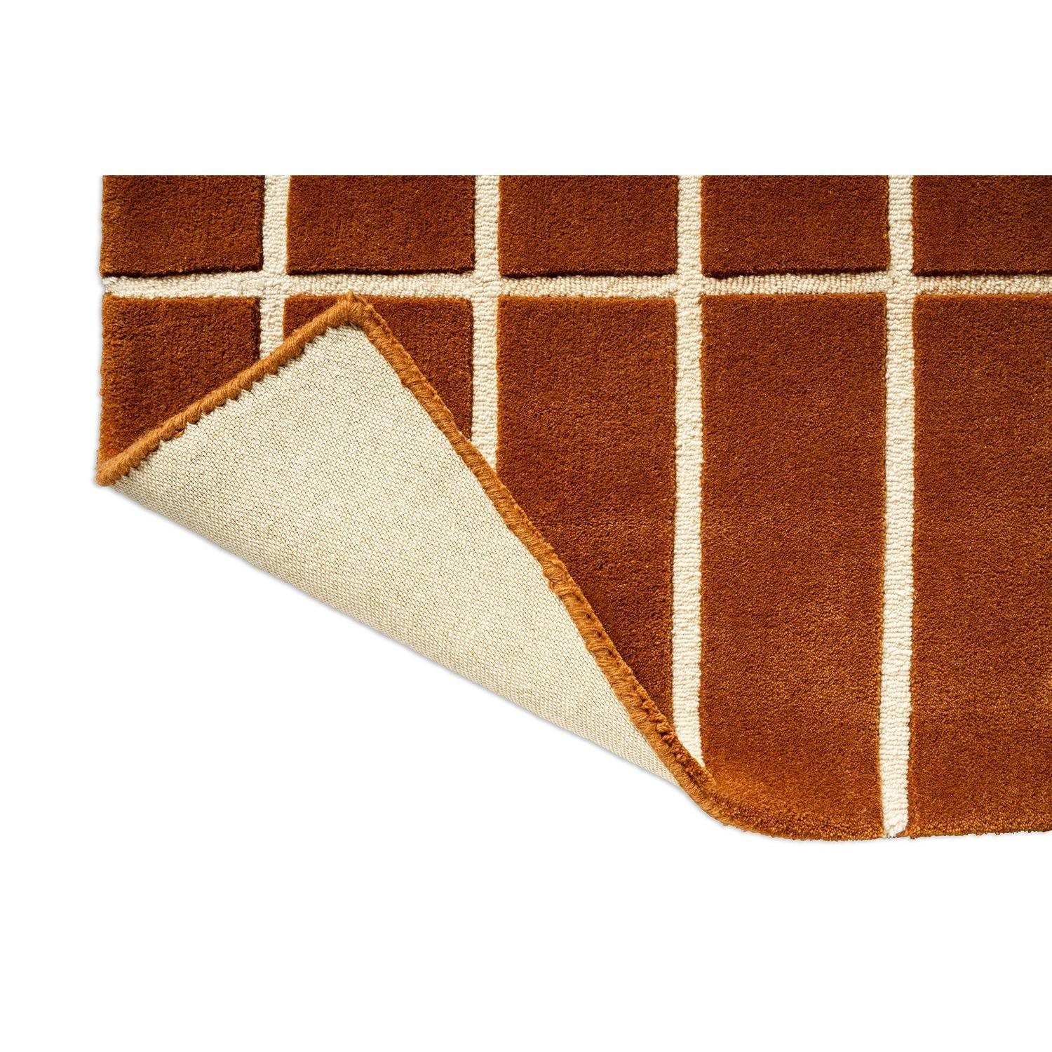 Marimekko Tiiliskivi Brown 132905 Rug featuring grid squares in burnt orange-brown and cream on brown, hand-tufted wool