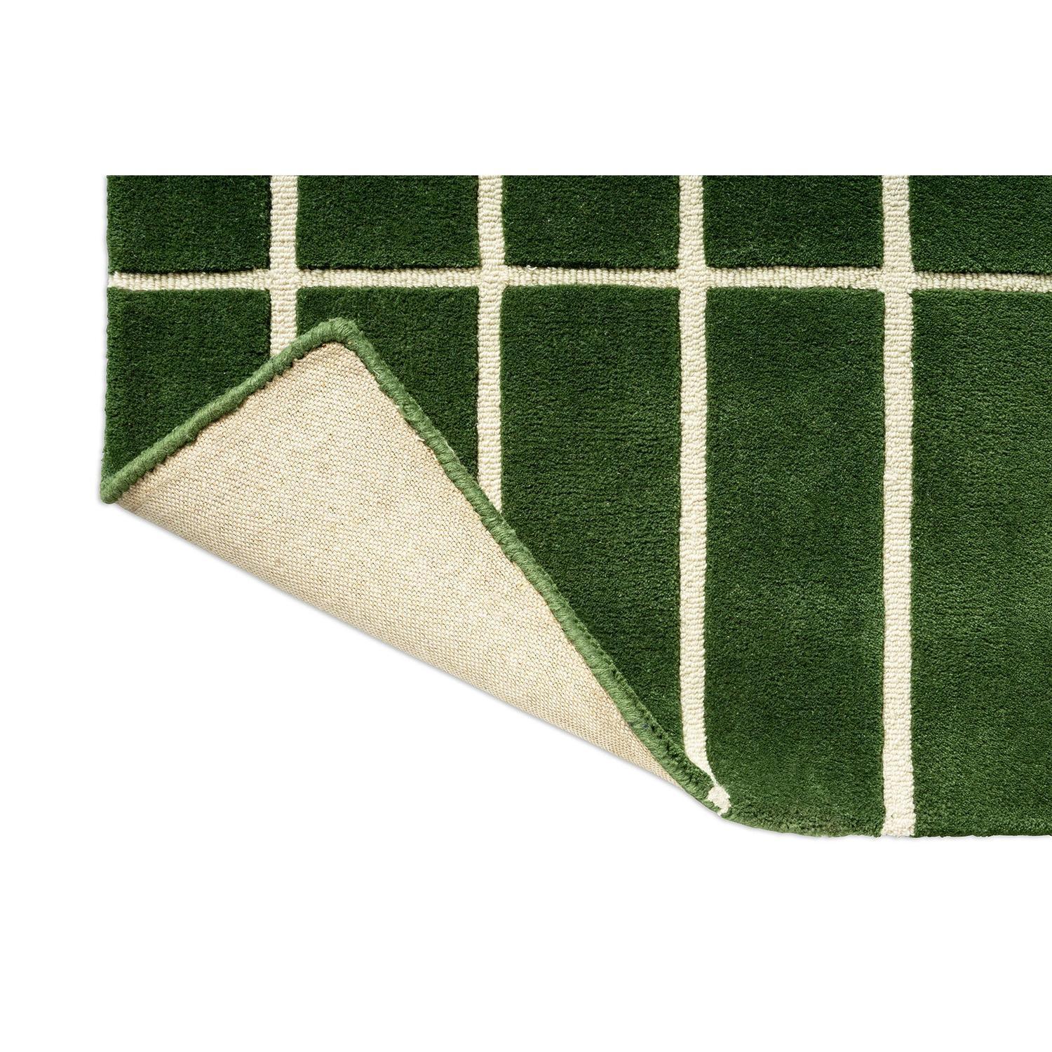 Marimekko Tiiliskivi Green 132907 Rug featuring grid pattern in dark green and cream on forest green background