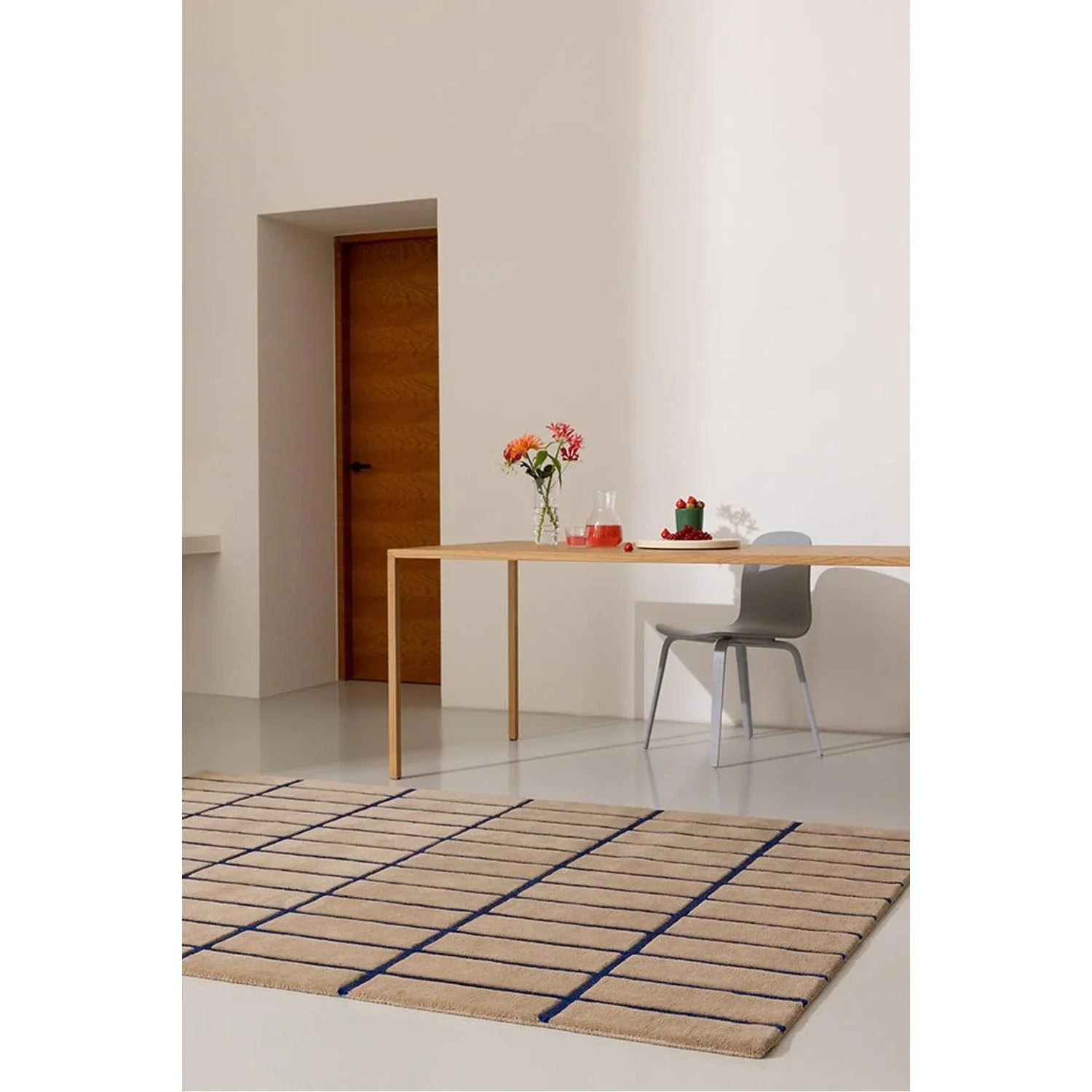 Marimekko Tiiliskivi Bright Blue Designer Rug featuring navy grid on natural beige background, machine-woven rug