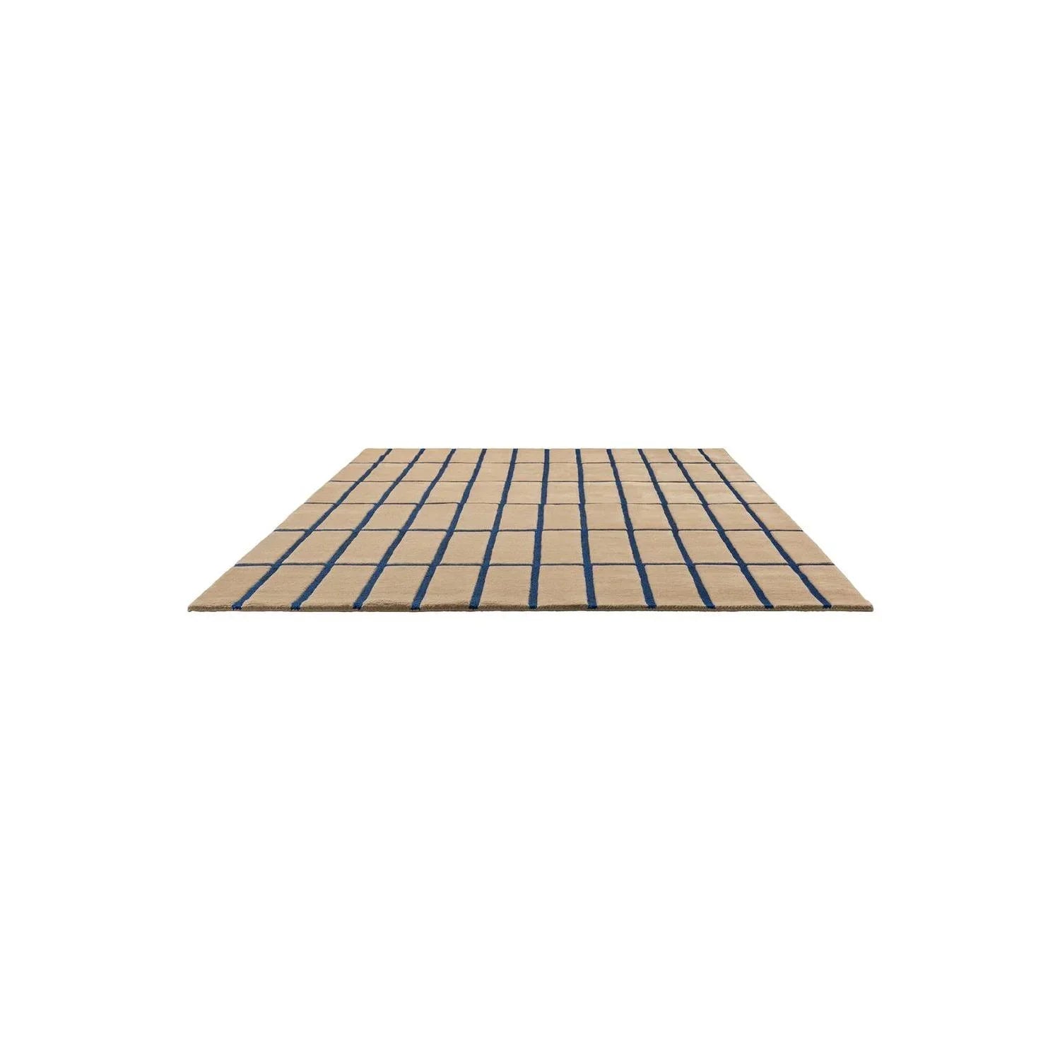 Marimekko Tiiliskivi Bright Blue Rug featuring brick-grid pattern in navy blue on beige background, flat-weave wool blend