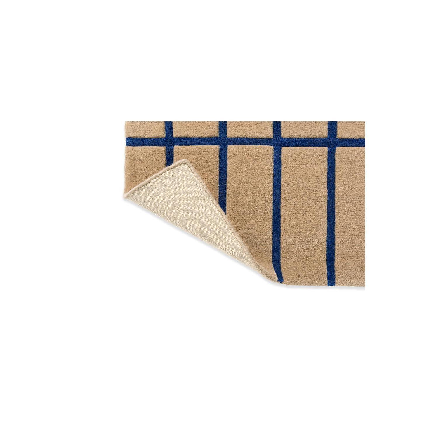 Marimekko Tiiliskivi Bright Blue rug featuring geometric grid in beige and royal blue on cream background, hand-tufted wool