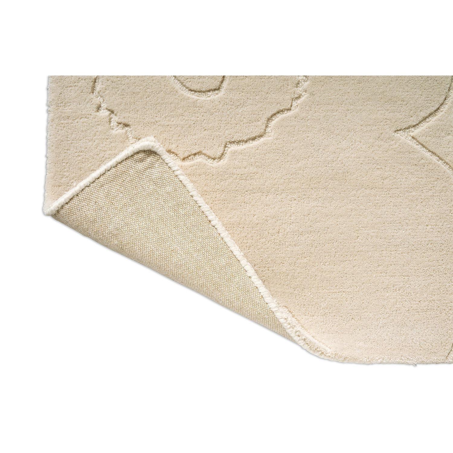 Marimekko Piirto Unikko Natural White rug featuring floral pattern in cream and ivory on beige, hand-tufted wool