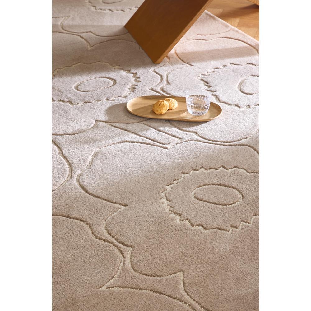 Marimekko Piirto Unikko Greige Rug featuring floral pattern in greige, beige and taupe on ivory background, tufted wool