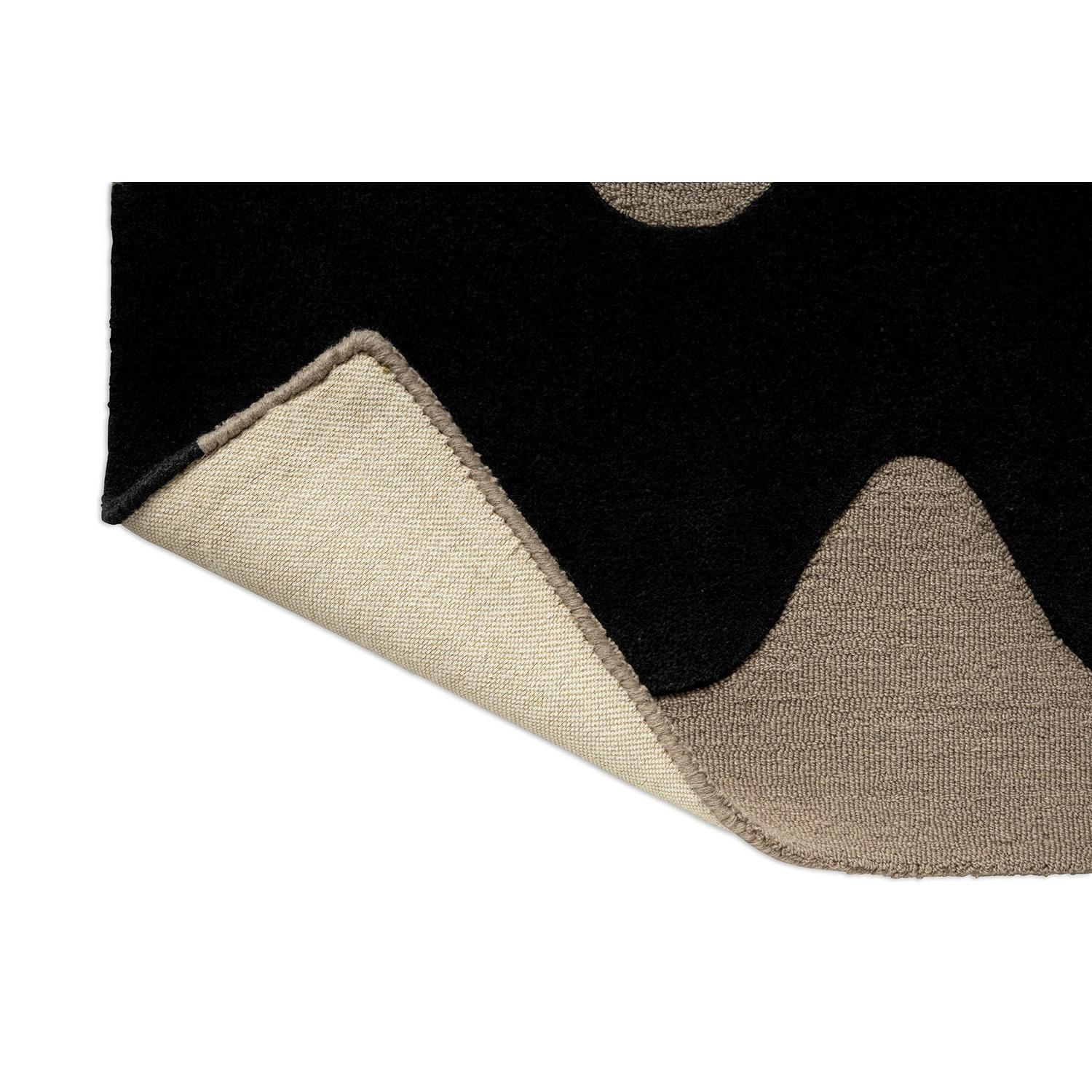 Marimekko Lokki runner rug featuring geometric pattern in black with beige taupe shapes on black background, hand-tufted wool
