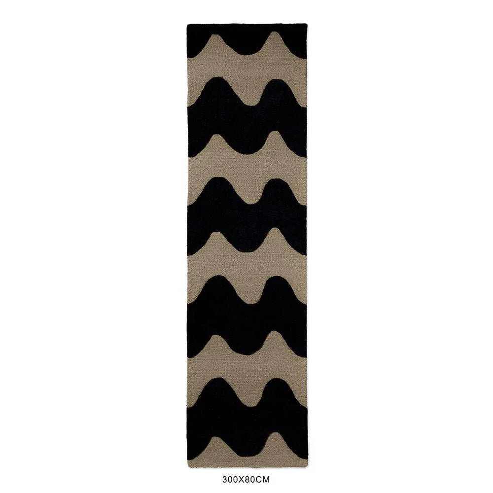 Marimekko Lokki Black 133905 Rug featuring wave motif in black and taupe on beige background, hand-tufted wool