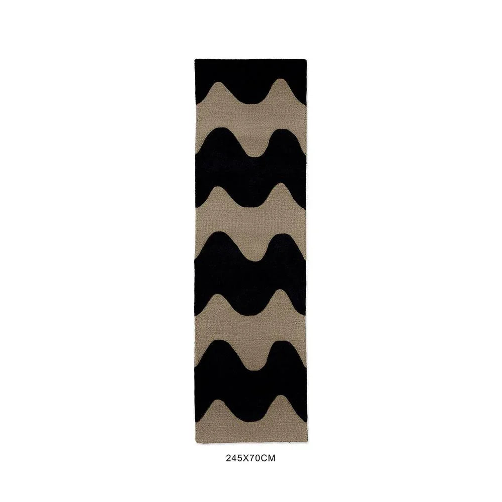Marimekko Lokki Black 133905 Rug featuring tan/beige and black wave motif on black background, hand-tufted wool