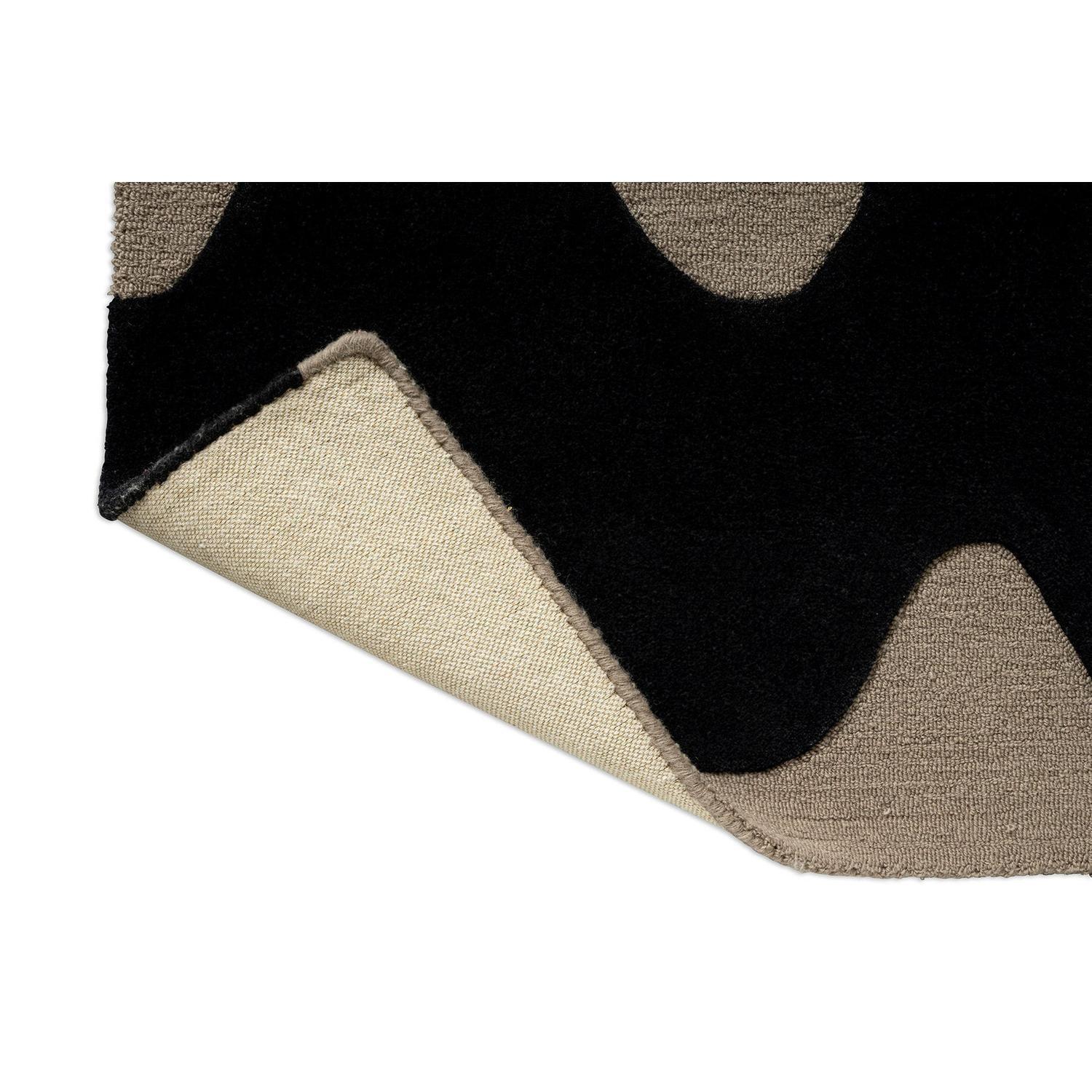 Marimekko Lokki Black Runner Rug featuring circles in taupe and beige on black background, hand-tufted wool