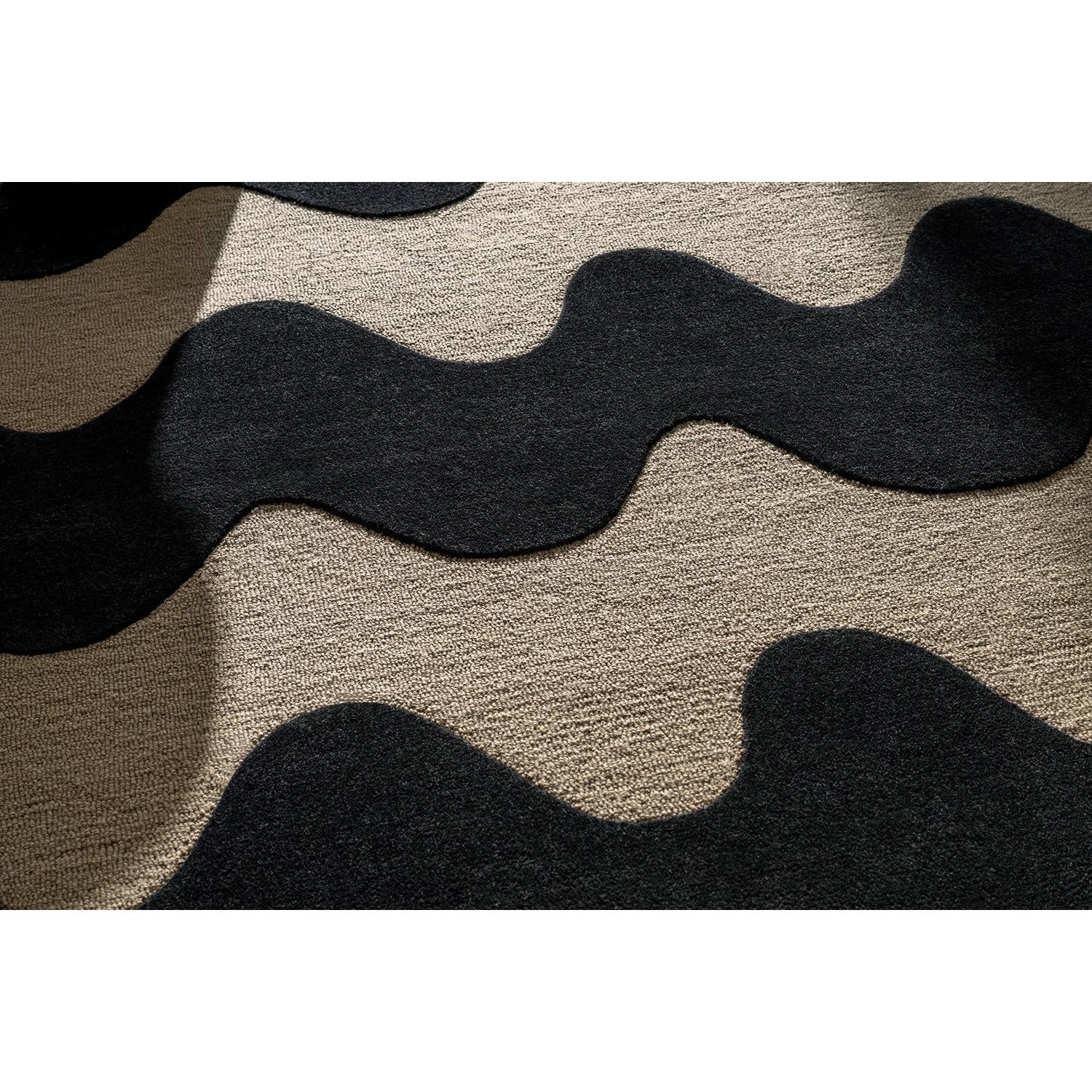 Marimekko Lokki Black 133905 Rug featuring abstract wavy pattern in black and charcoal on beige background, woven wool