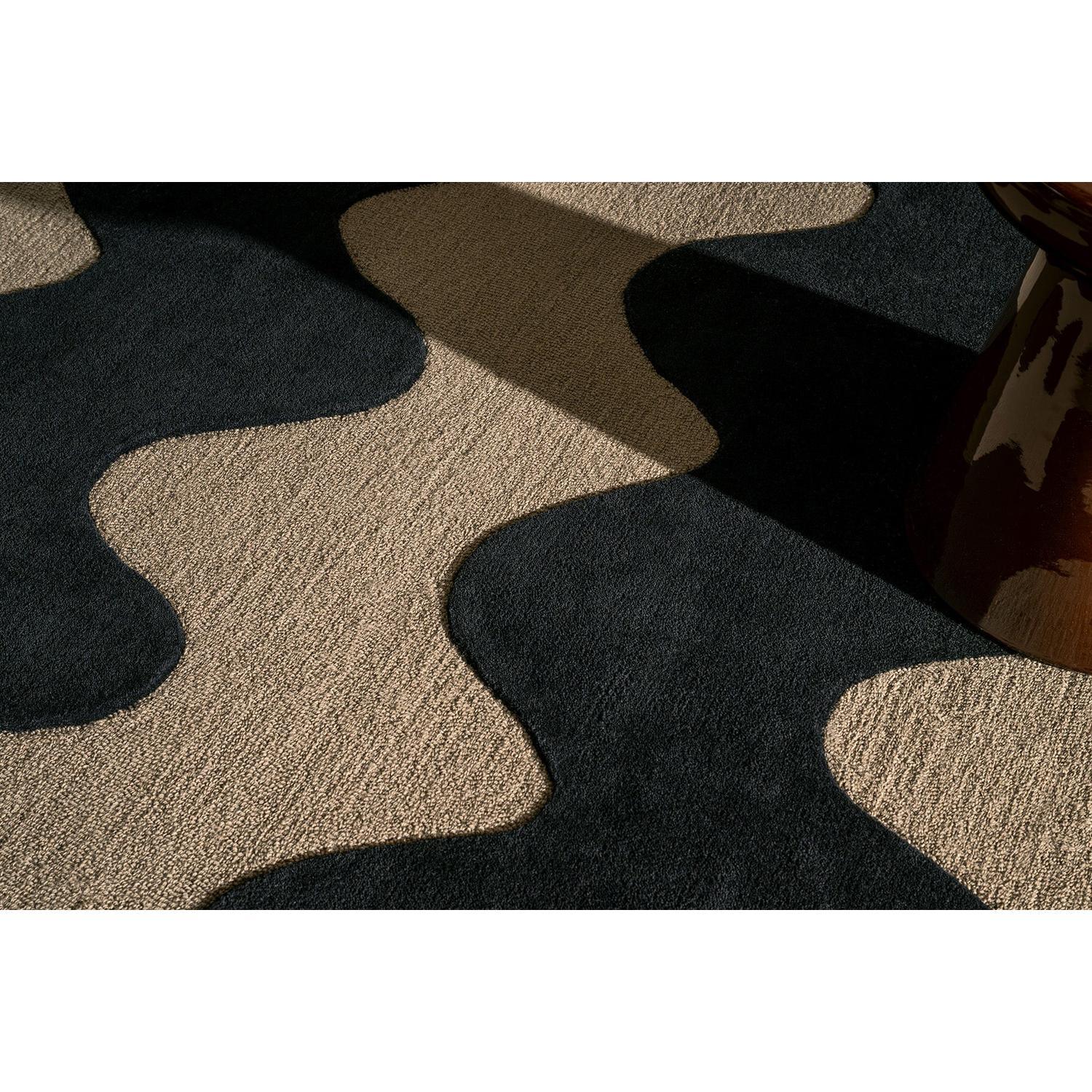 Marimekko Lokki Black 133905 Rug featuring an abstract blob pattern in black and sand on beige background