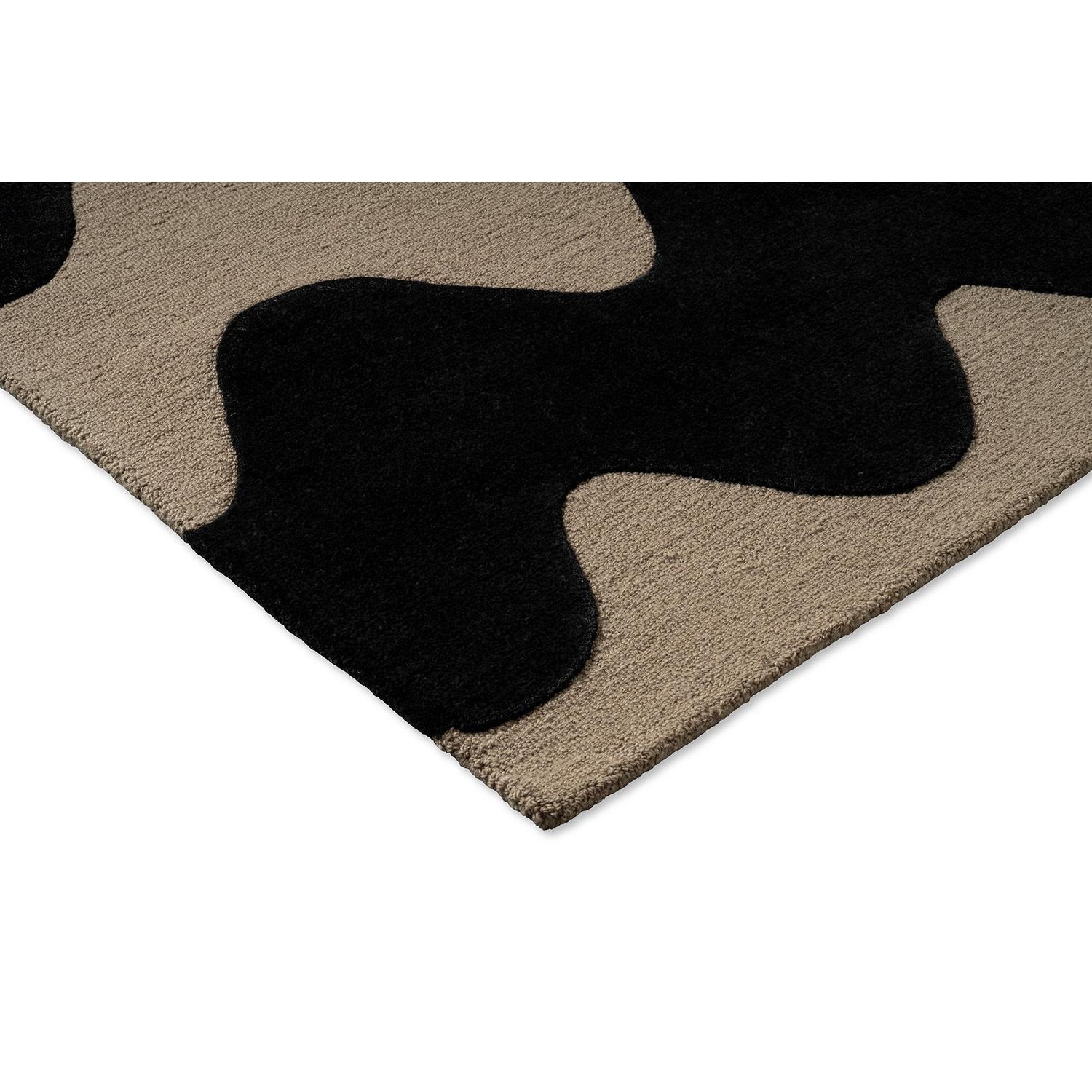 Marimekko Lokki Rug featuring abstract camouflage pattern in black, taupe and beige on beige background, tufted wool