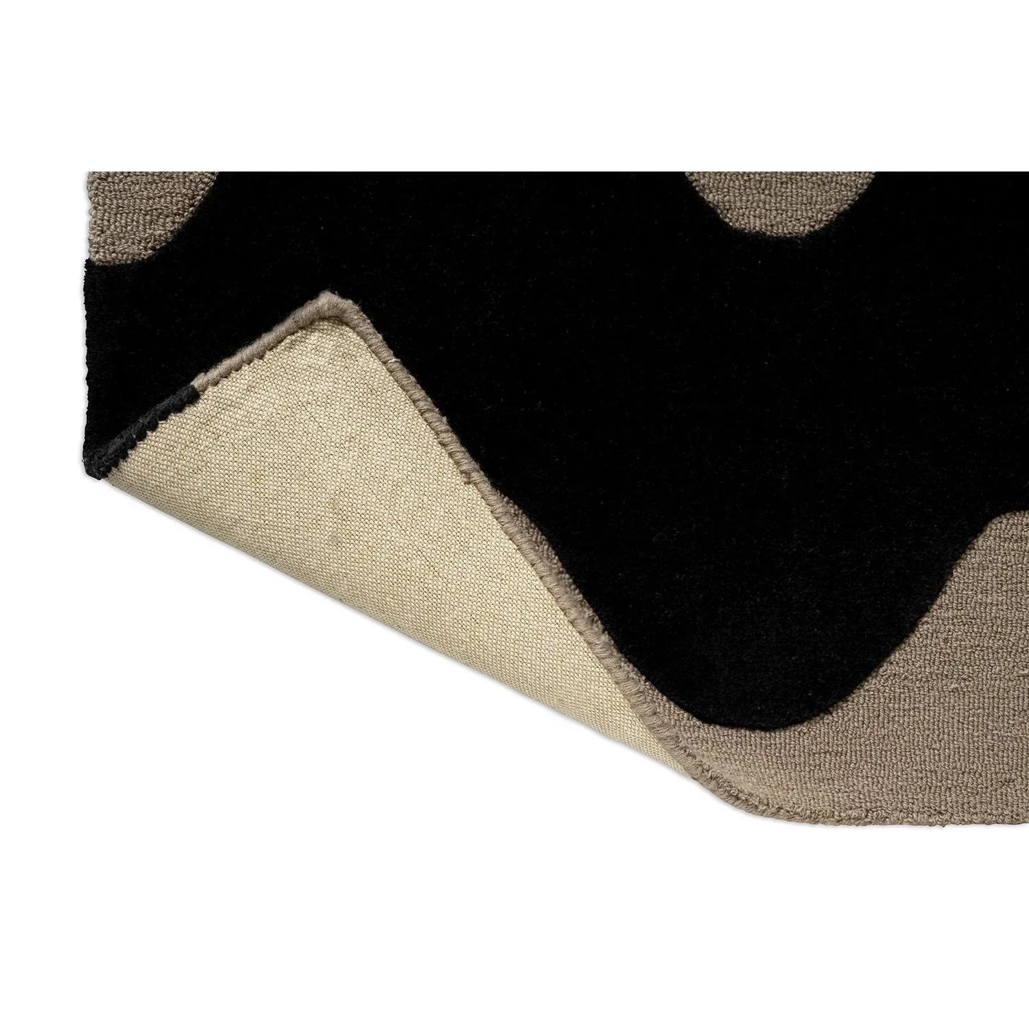 Marimekko Lokki Black 133905 Rug featuring circular motif pattern in black, beige, taupe on black background, woven wool