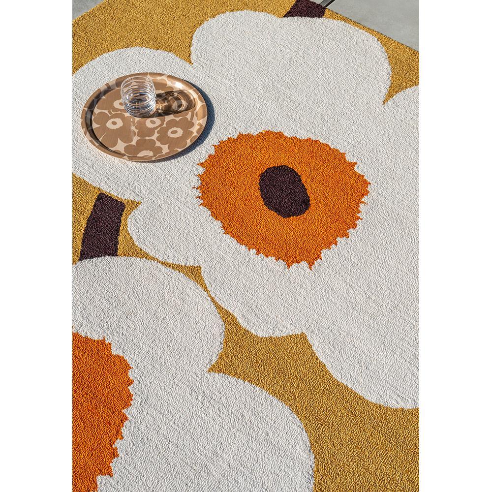 Marimekko Unikko Anniversary Honey Outdoor Rug featuring white poppies with orange centers on honey-beige background