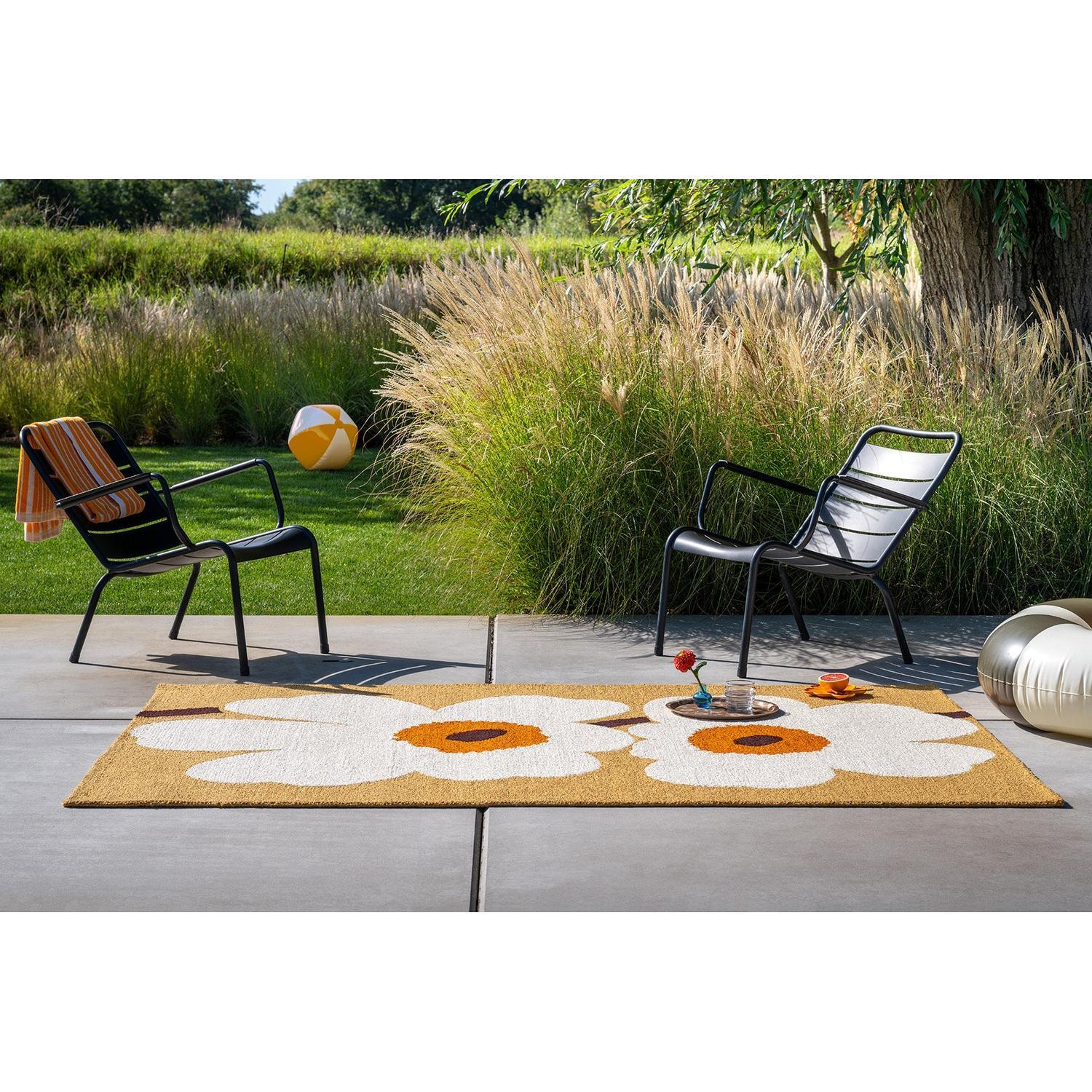Marimekko Unikko Honey Outdoor Rug with white/orange floral pattern on honey background, machine-made polypropylene