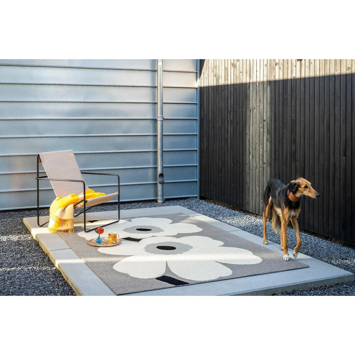 Marimekko Unikko Grey Outdoor Rug featuring floral motif in white, black and grey on grey, power-loomed polypropylene