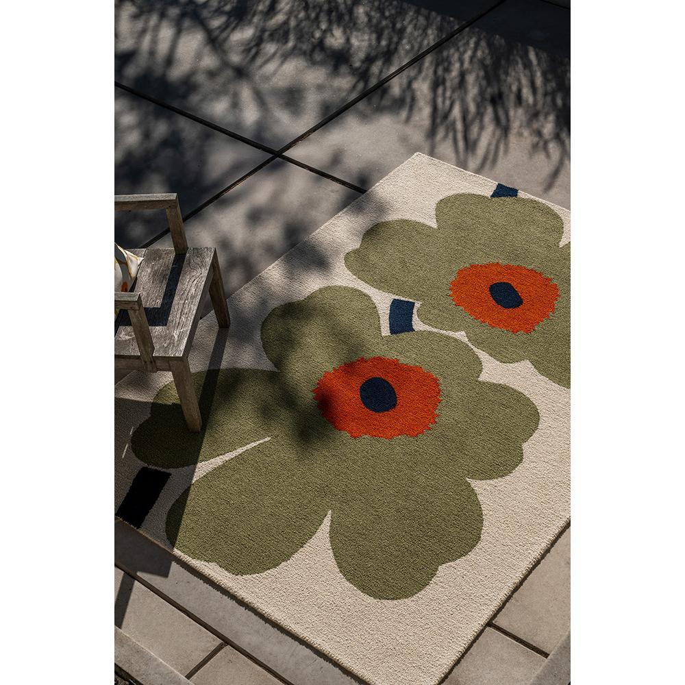 Marimekko Unikko Outdoor Rug featuring floral pattern in dusty green navy orange on cream machinewoven polypropylene