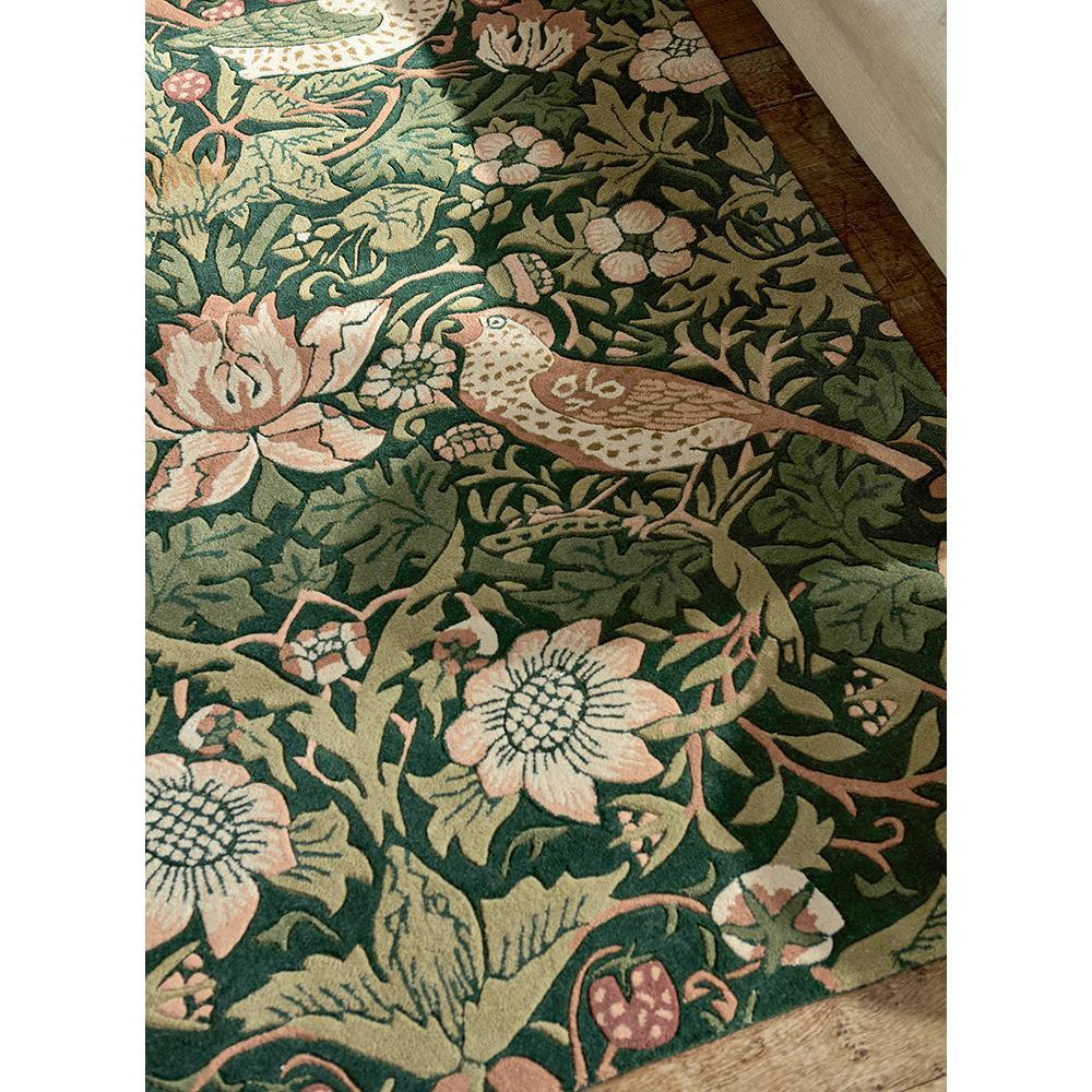 Morris & Co Strawberry Thief Forest rug with botanical pattern in forest green, blush pink, cream on dark green, machine-woven wool
