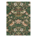 Morris and Co Strawberry Thief Forest hand-tufted wool rug featuring William Morris iconic 1883 design with symmetrical thrushes stealing strawberries in deep forest green, coral red, soft pink, and golden tan

