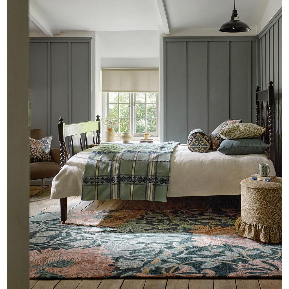 Morris & Co Honeysuckle & Tulip Teal Designer Rug featuring botanical floral pattern in teal, blush pink, cream on warm beige floor, woven wool
