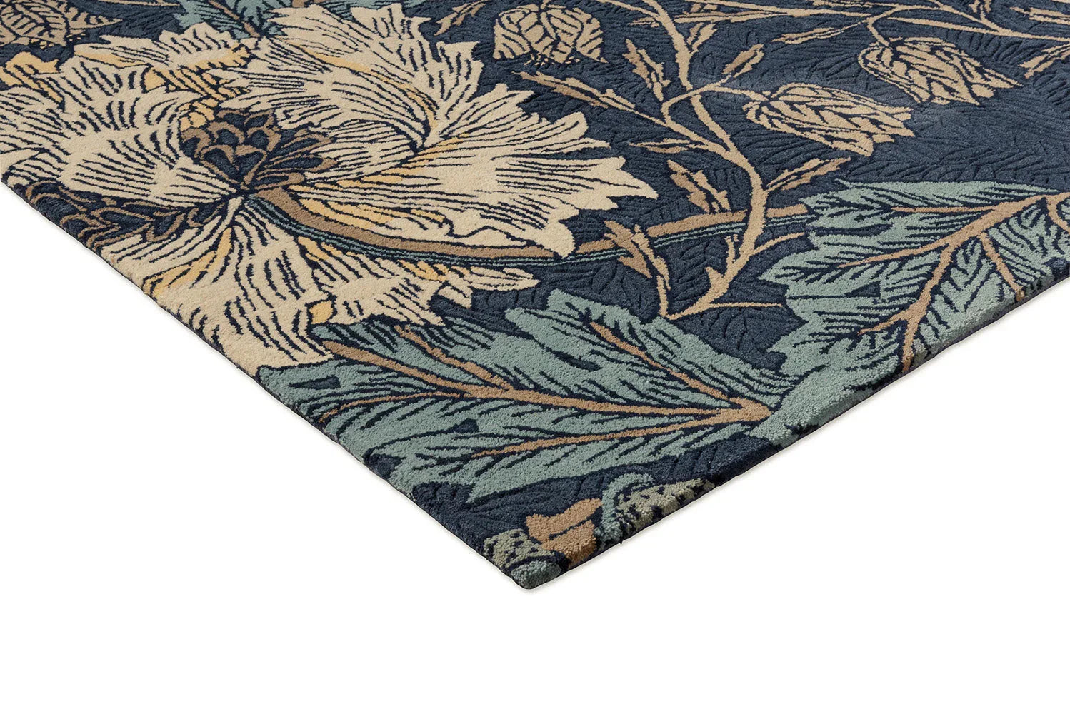 Morris & Co Honeysuckle & Tulip Woad Thyme rug with botanical pattern in navy, cream and sage on navy background, machine-made wool