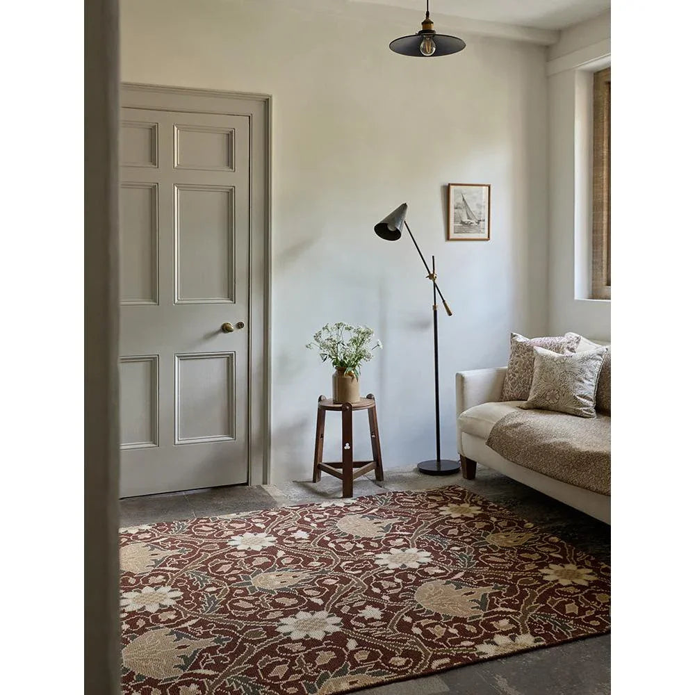 Morris & Co Montreal Russet rug featuring ornate floral pattern in russet, cream, beige and taupe on warm cream background, hand-tufted wool