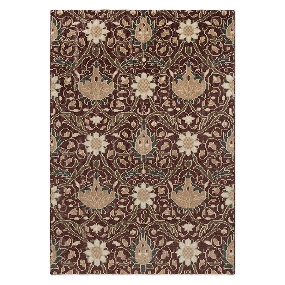 Morris and Co Montreal Russet hand-knotted wool rug featuring John Henry Dearle 1890s Persian-inspired design with oversized trailing flowers in russet brown, cream, and sage green on burgundy background
