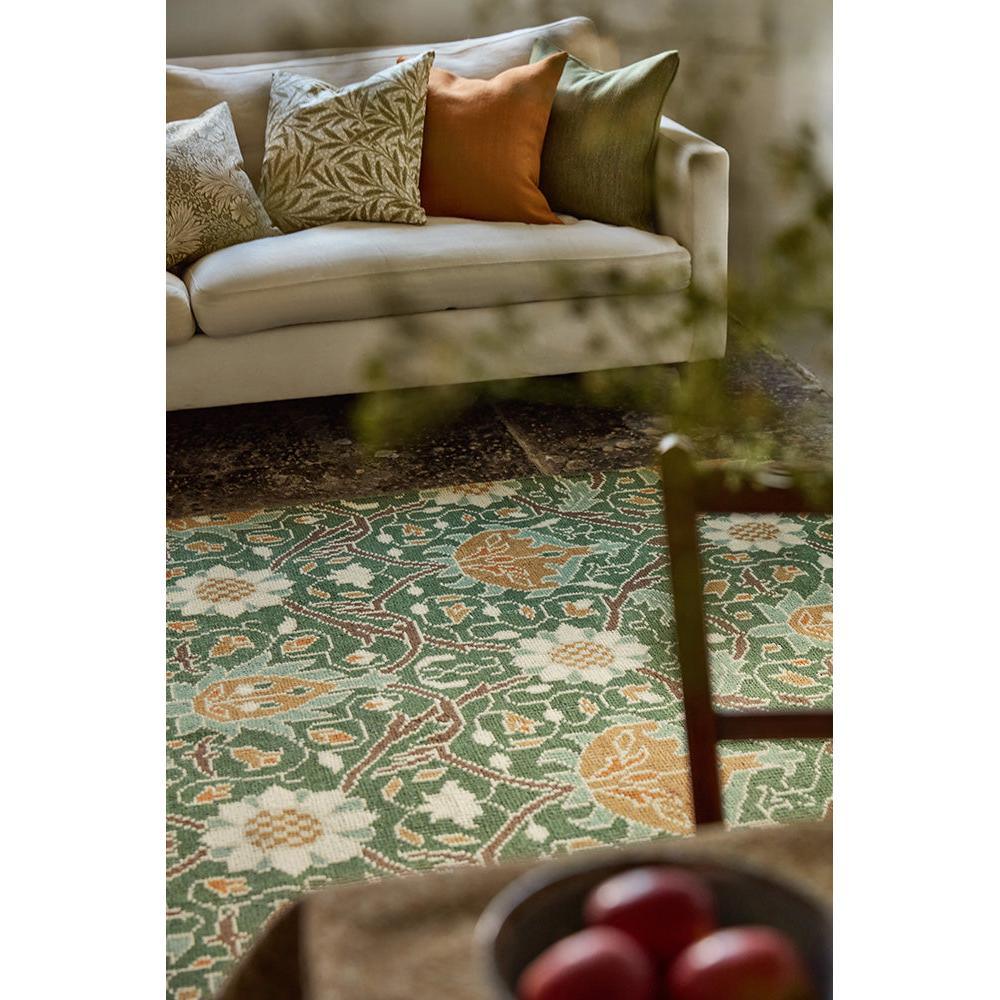 Morris & Co Montreal Forest Rug featuring floral pattern in forest green, cream, rust on ivory background, hand-tufted wool