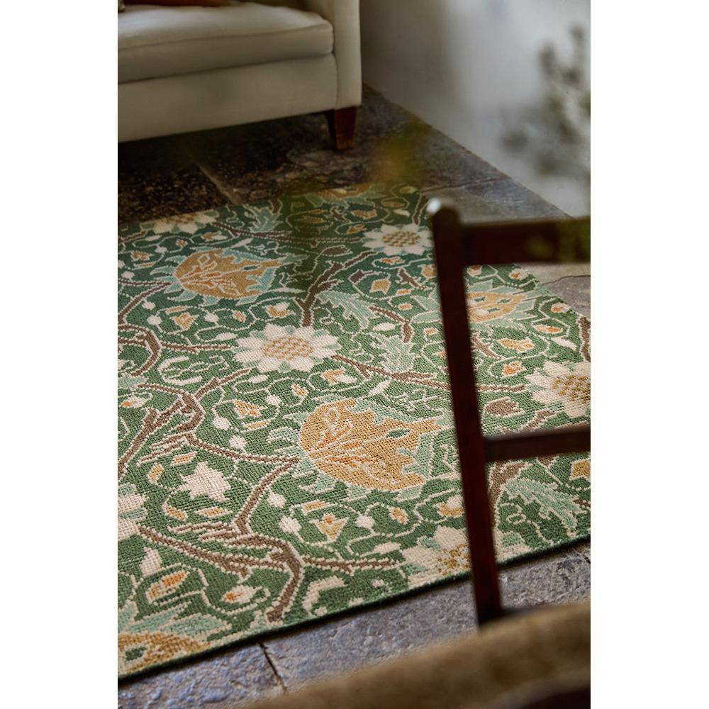 Morris & Co Montreal Forest Rug featuring botanical floral pattern in forest green, cream, ochre on beige background, hand-tufted wool