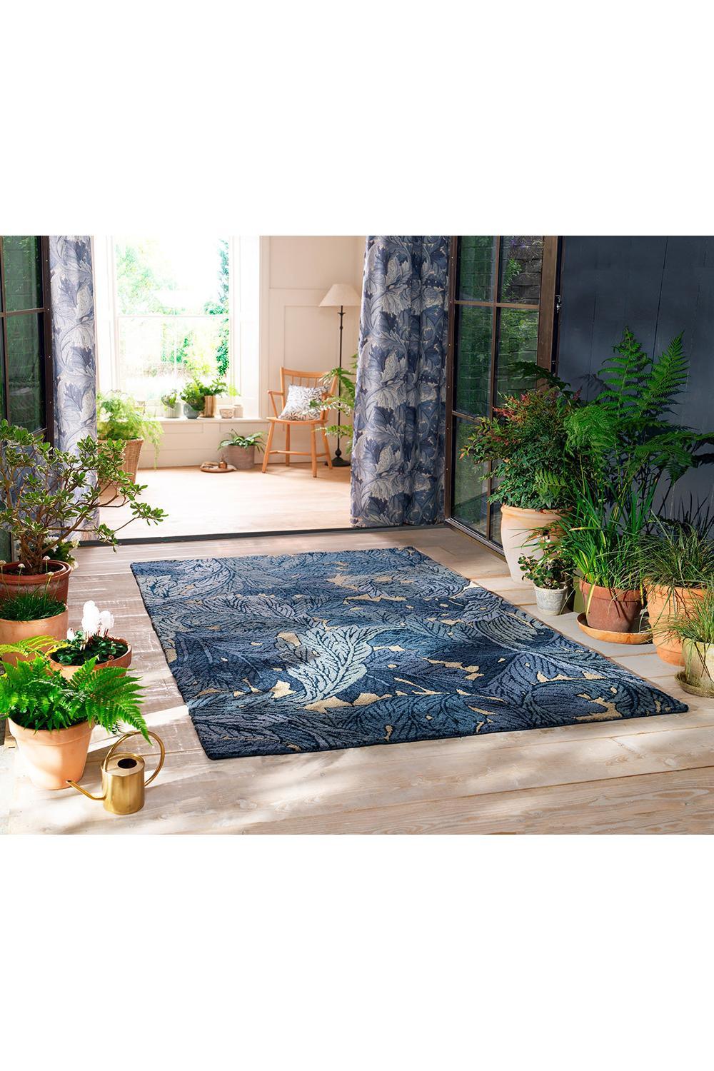 Morris & Co Acanthus Indigo outdoor rug featuring botanical pattern in indigo, navy and beige on light background, flat-weave polypropylene
