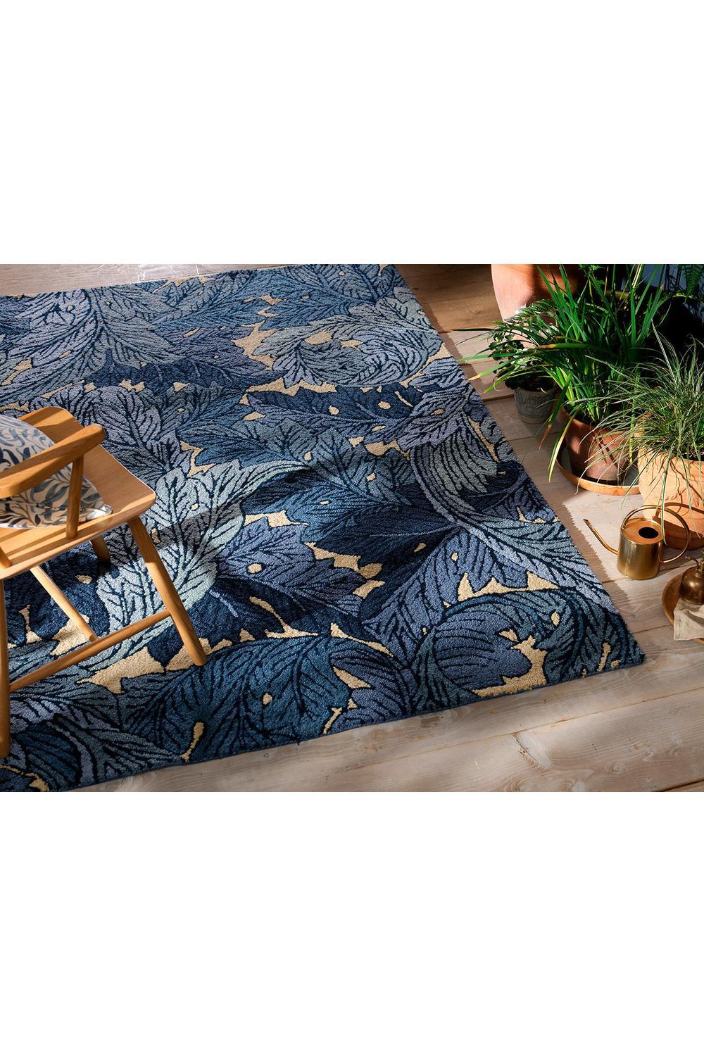 Morris & Co Acanthus Indigo outdoor rug featuring acanthus leaf pattern in indigo and tan on beige background, machine-woven polypropylene